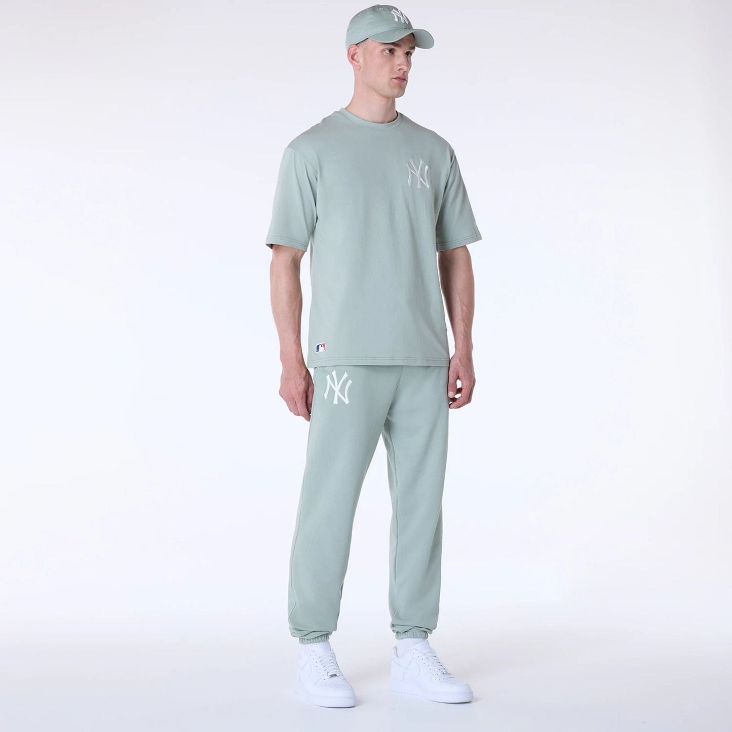 The Male model is wearing New York Yankees MLB League Essential Pastel Green Fleece Joggers 8