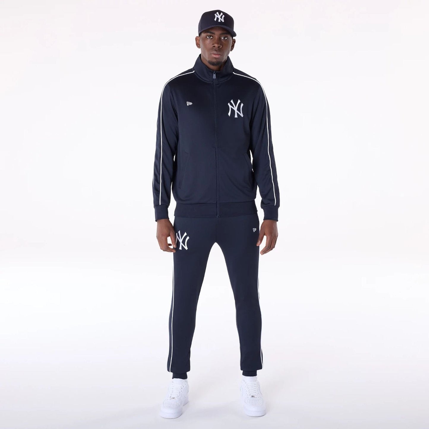 The Male model is wearing New York Yankees MLB Track Pants Navy Fleece Joggers 8