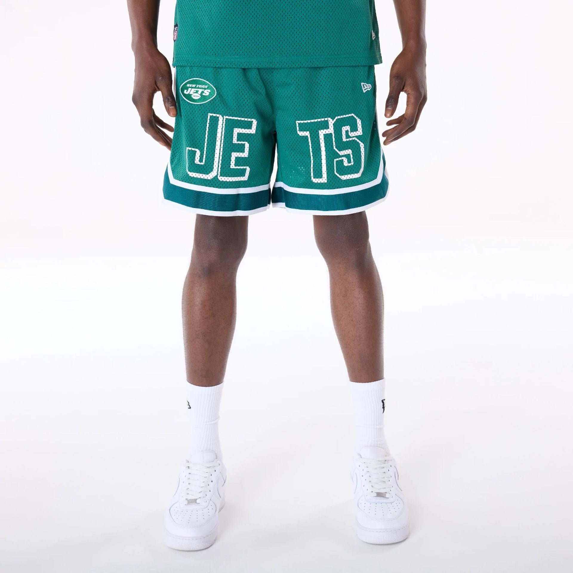 The Male model is wearing New York Jets NFL Mesh Green Shorts 1