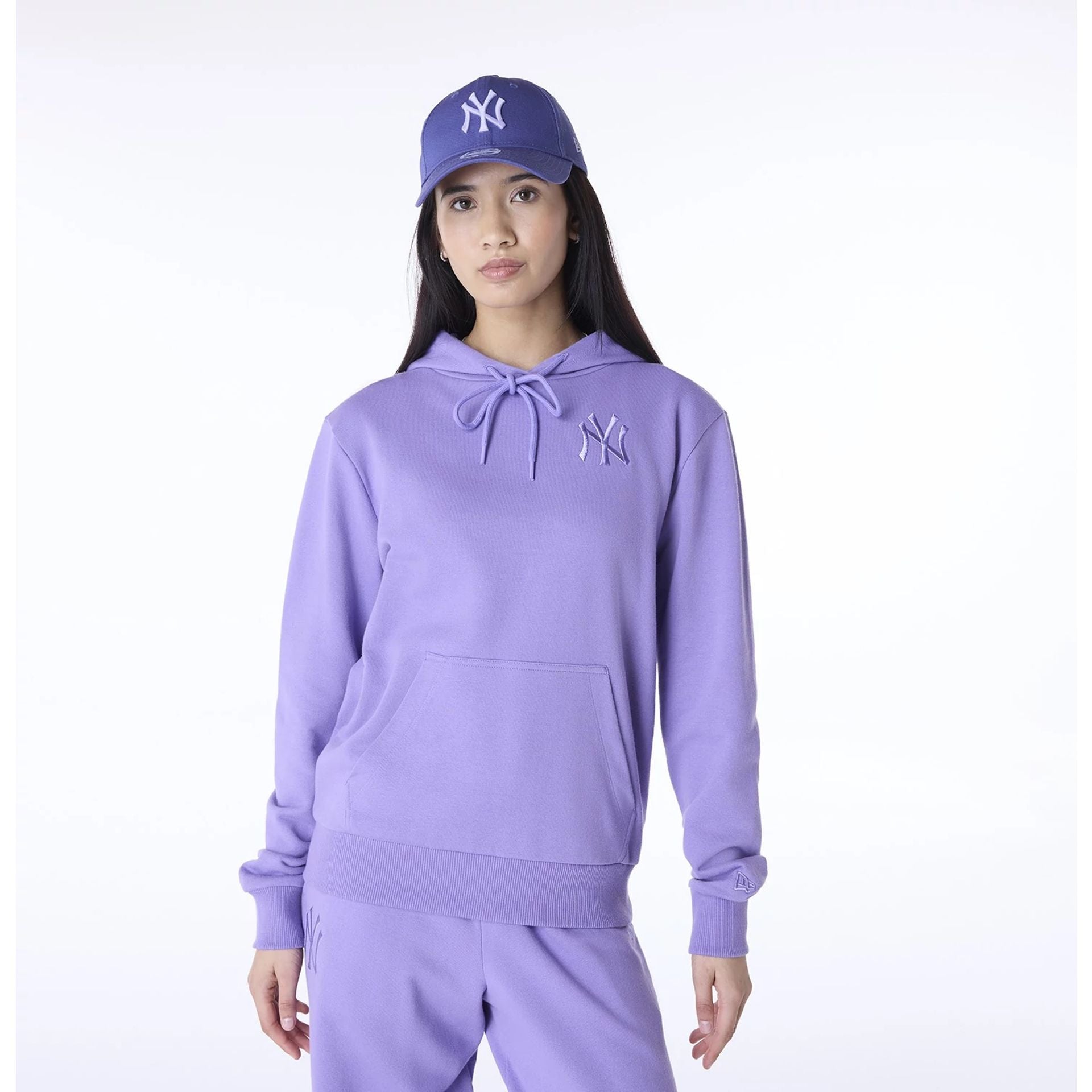 The Female model is wearing New York Yankees Womens MLB League Essential Purple Pullover Hoodie 1