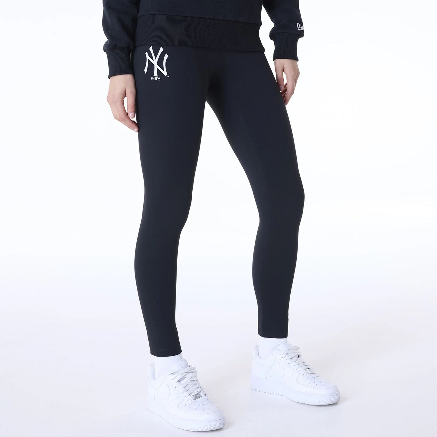 The Female model is wearing New York Yankees Womens MLB League Essential Black Leggings 8