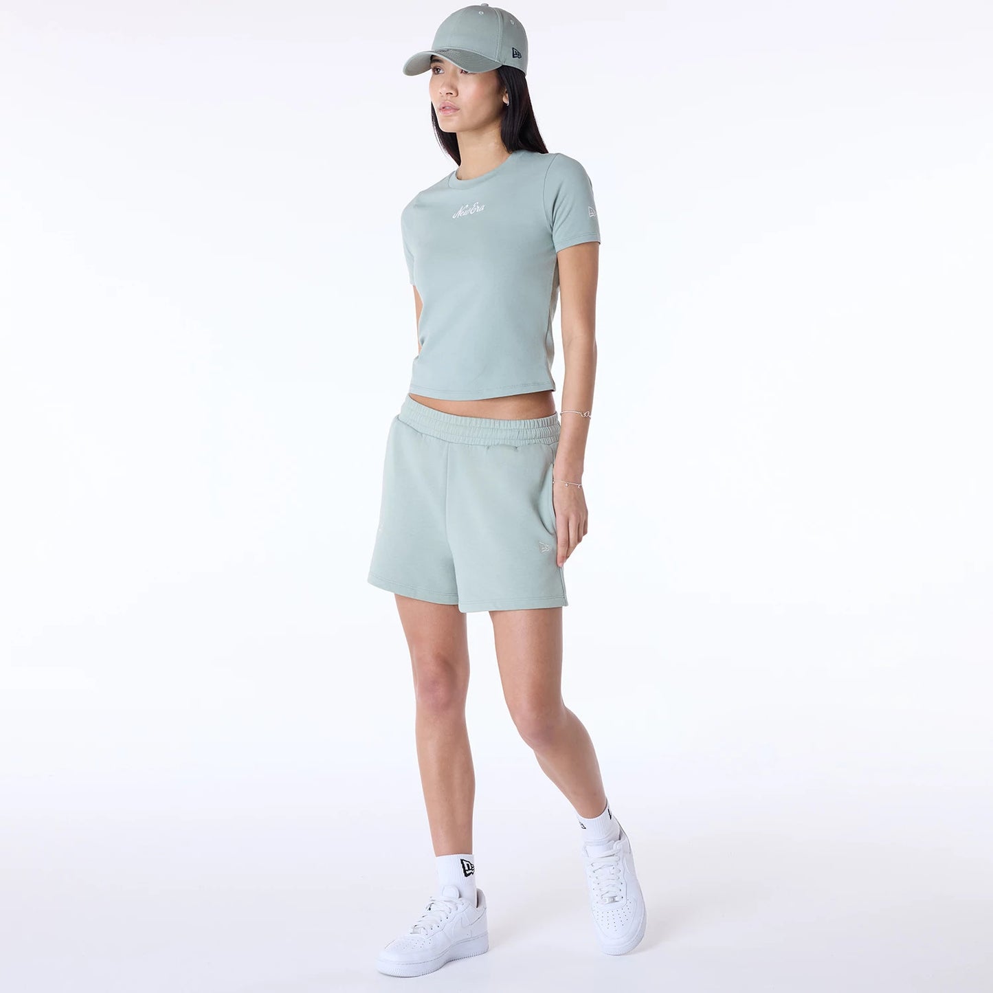 The Female model is wearing Womens New Era Slim Pastel Blue T-Shirt 8
