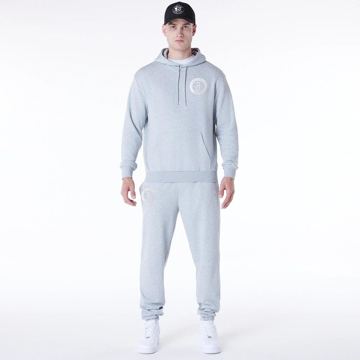 The Male model is wearing Brooklyn Nets NBA League Essential Grey Oversized Pullover Hoodie 3