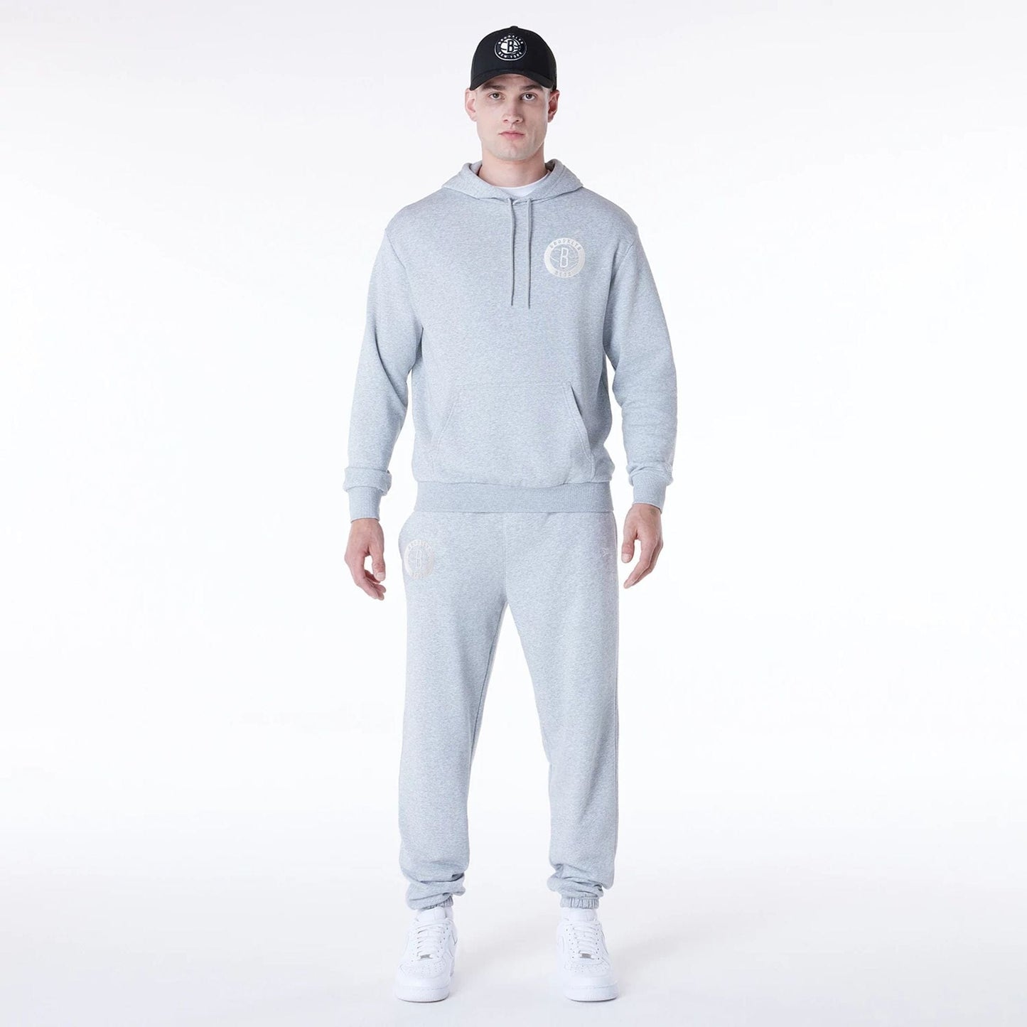 The Male model is wearing Brooklyn Nets NBA League Essential Grey Fleece Joggers 8