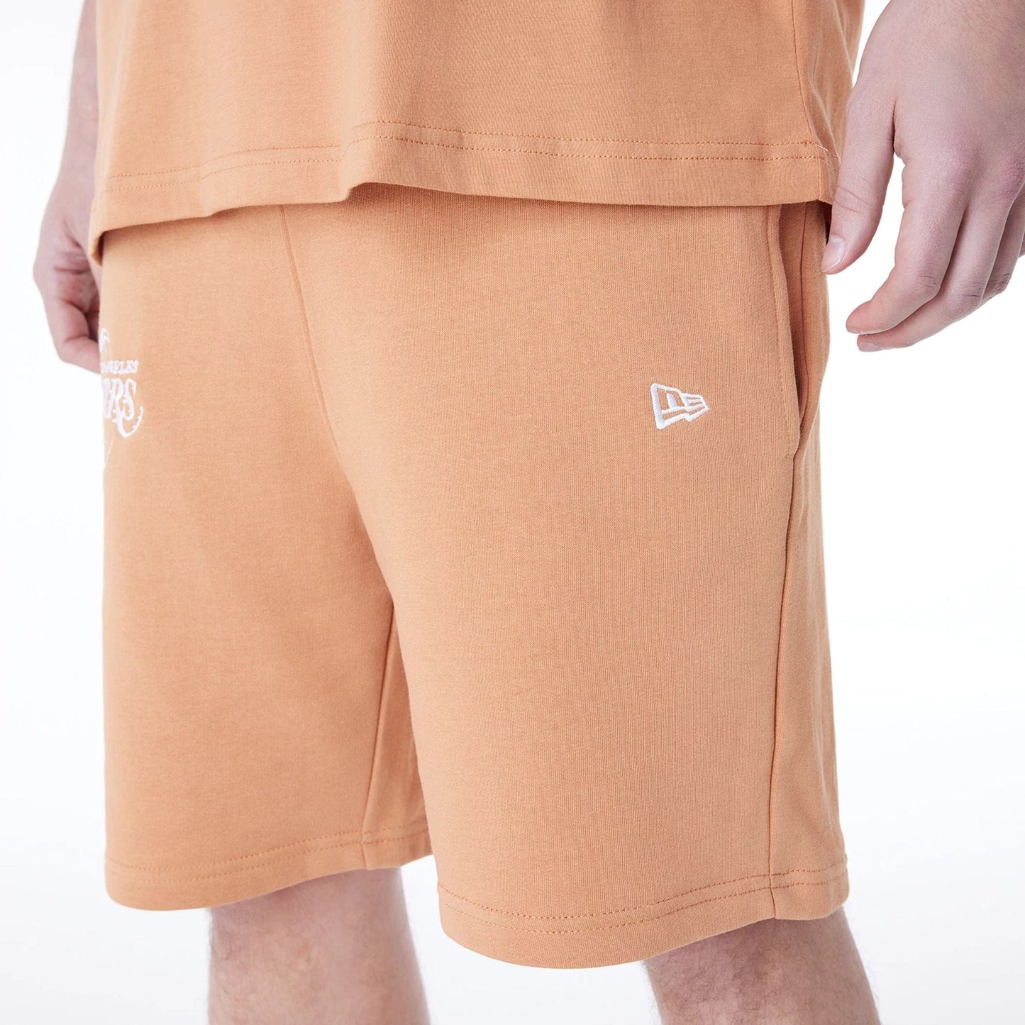 The Male model is wearing LA Lakers NBA League Essential Dark Beige Shorts 8