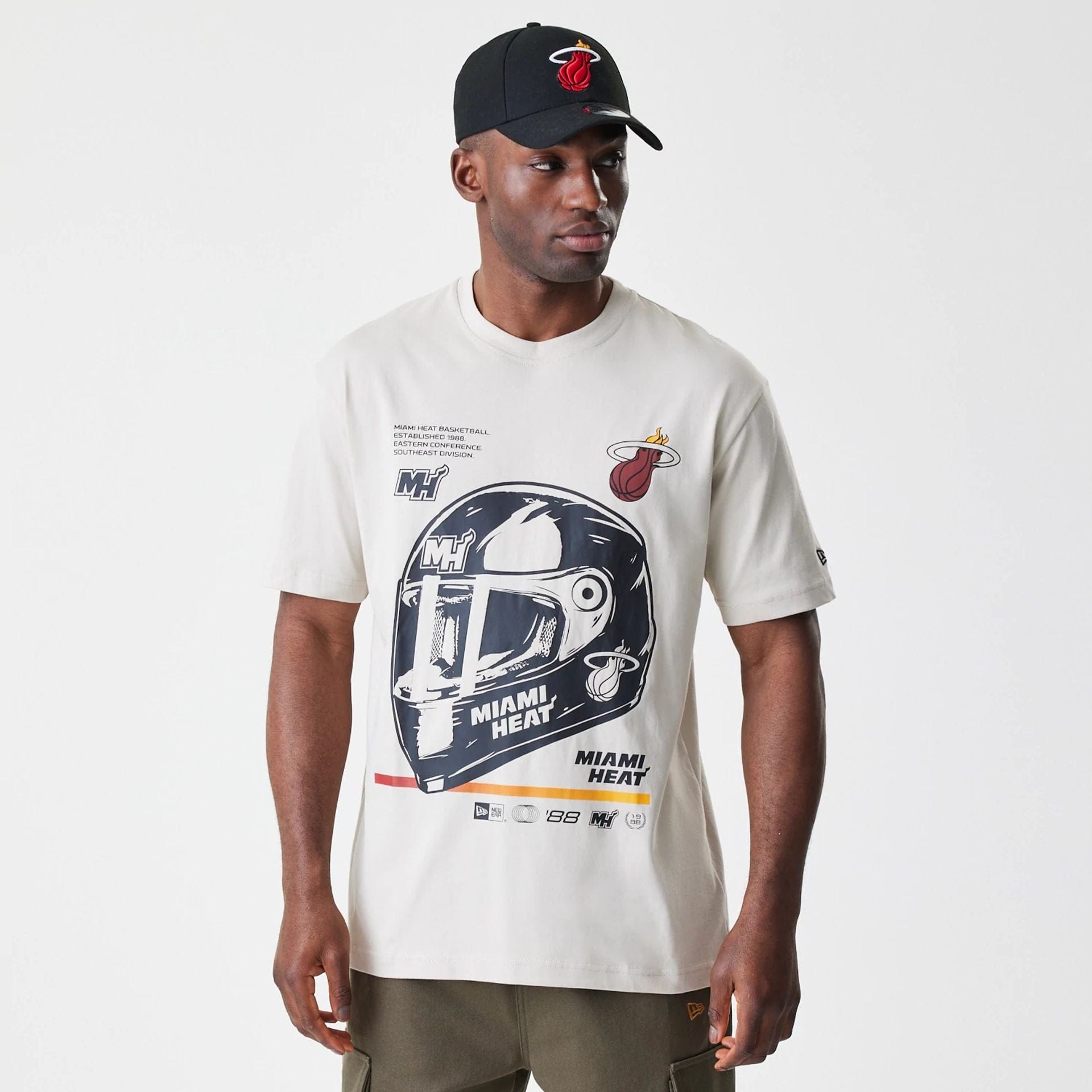 The Male model is wearing Miami Heat Modern Driver Light Beige T-Shirt 1