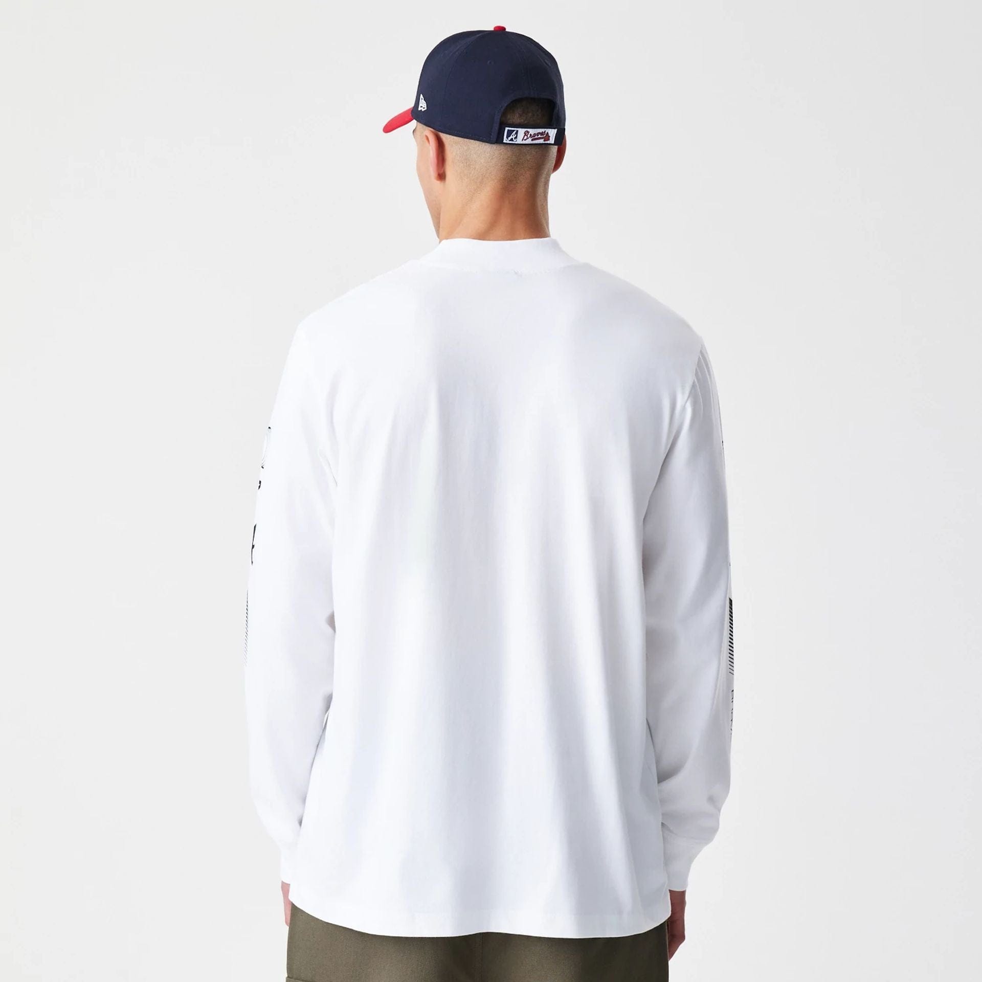 The Male model is wearing Atlanta Braves Modern Driver White Long Sleeve T-Shirt 2