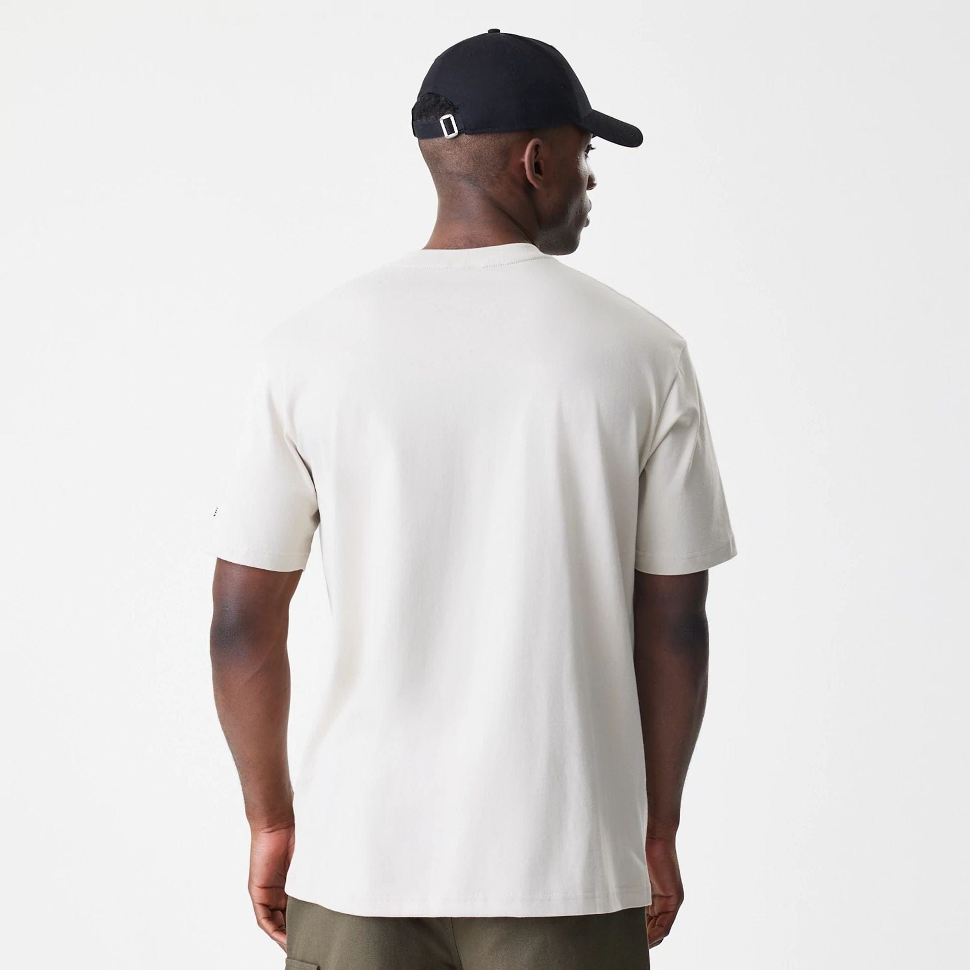 The Male model is wearing Nascar Generic Logo Modern Driver Light Beige T-Shirt 2