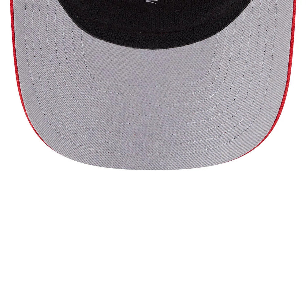 Kansas City Chiefs NFL Evergreen Red New Era 9SEVENTY Stretch Snap Adjustable Cap, inside view showing the grey undervisor with stitching detail and the black sweatband lining, highlighting the structured design.