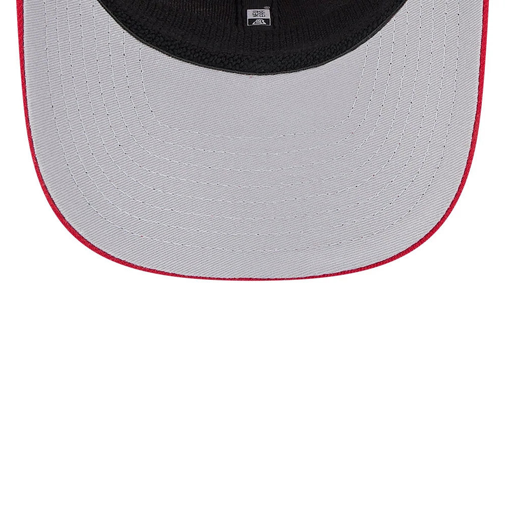 Cincinnati Reds MLB Evergreen Red New Era 9SEVENTY Stretch Snap Adjustable Cap, inside view showing a grey undervisor with red stitching, a black sweatband, and the New Era logo on the taping.