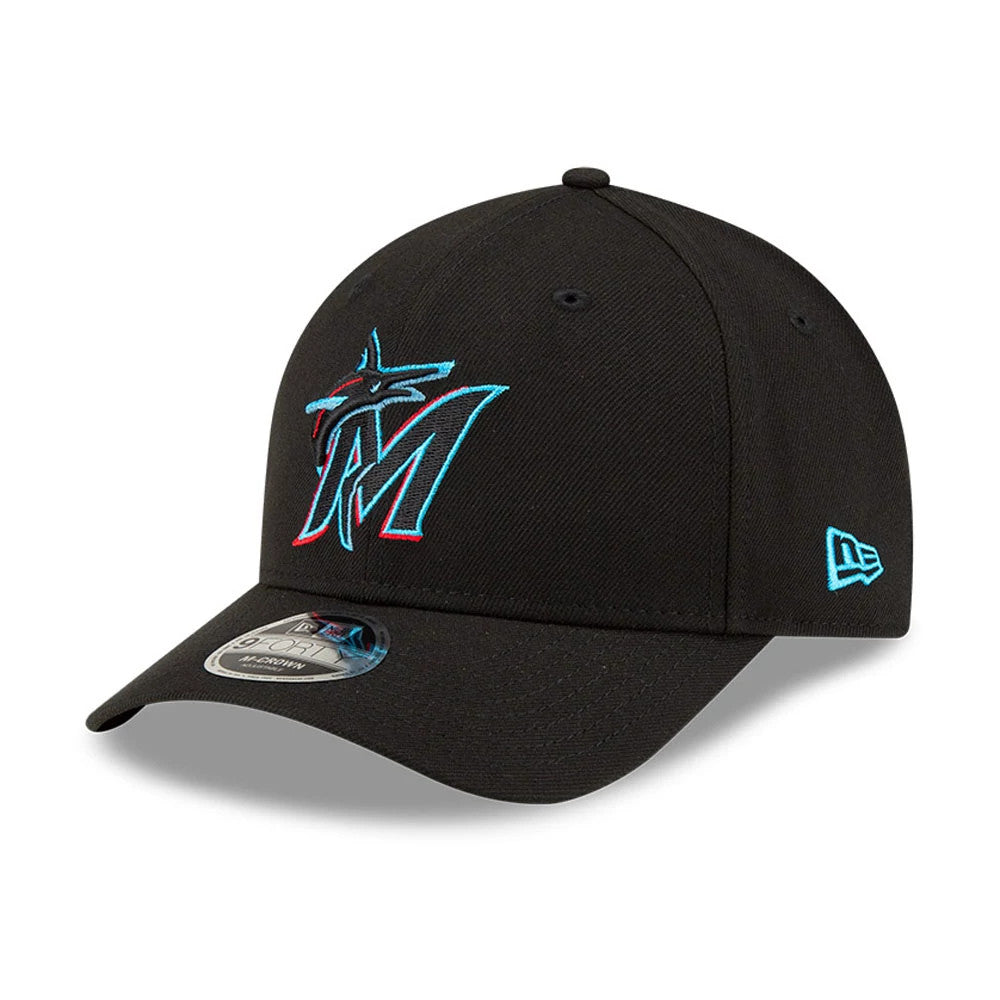 Miami Marlins MLB Player Replica Black New Era 9FORTY M-Crown Adjustable Cap, three-quarter view showing the raised pink and blue embroidered M logo on the front panel, curved visor with 9FORTY size sticker, and New Era flag logo on the left side.