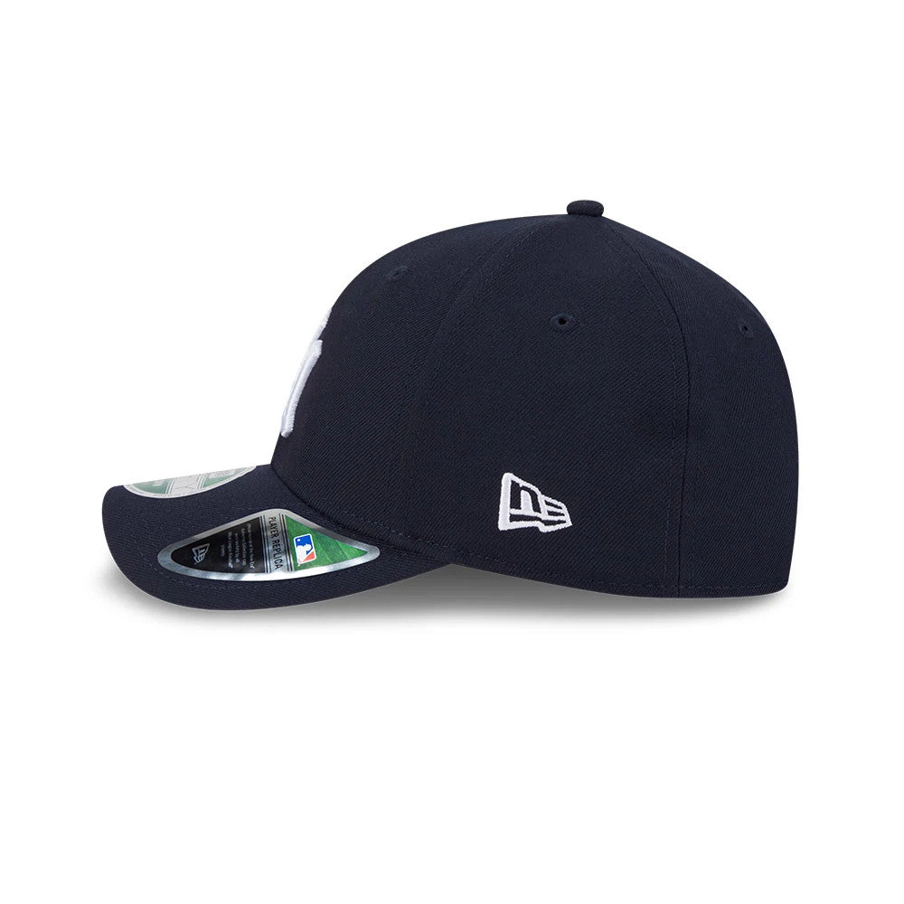 New York Yankees MLB Player Replica Navy New Era 9FORTY M-Crown Adjustable Cap, side view showing the white New Era flag logo on the left side, curved visor with a 9FORTY size sticker and structured navy crown.