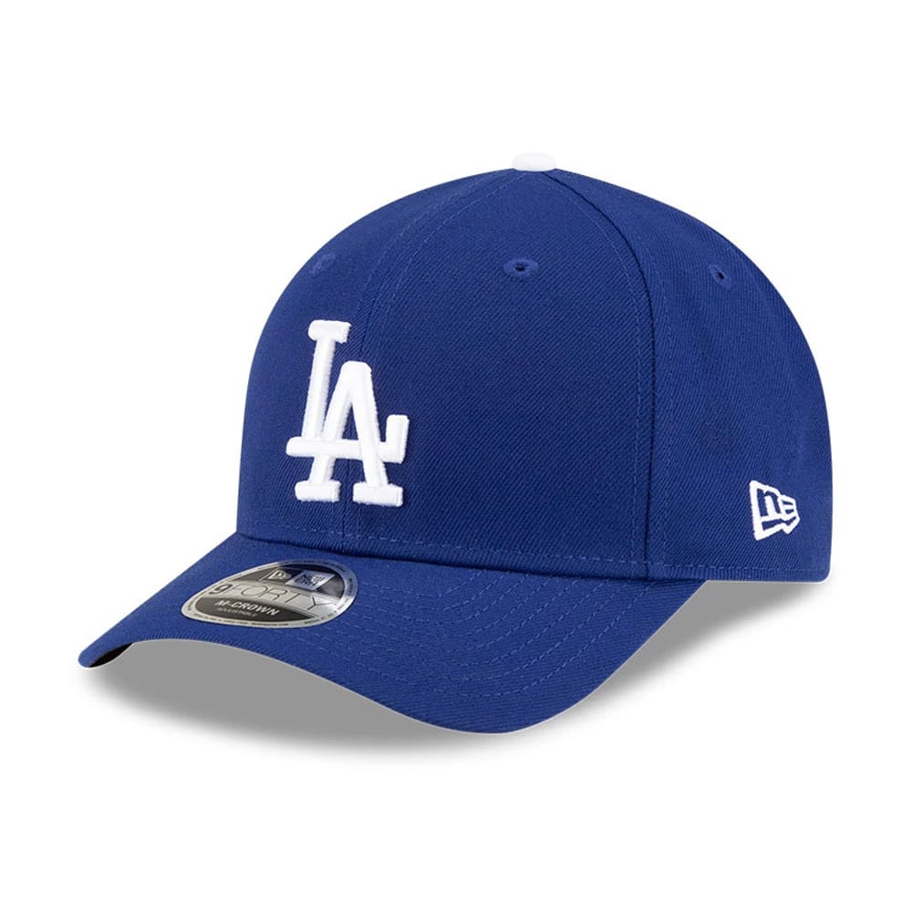 LA Dodgers MLB Player Replica Dark Blue New Era 9FORTY M-Crown Adjustable Cap, three-quarter view with raised white LA logo on the front panel, curved visor featuring a 9FORTY size sticker, and New Era flag logo on the left side.
