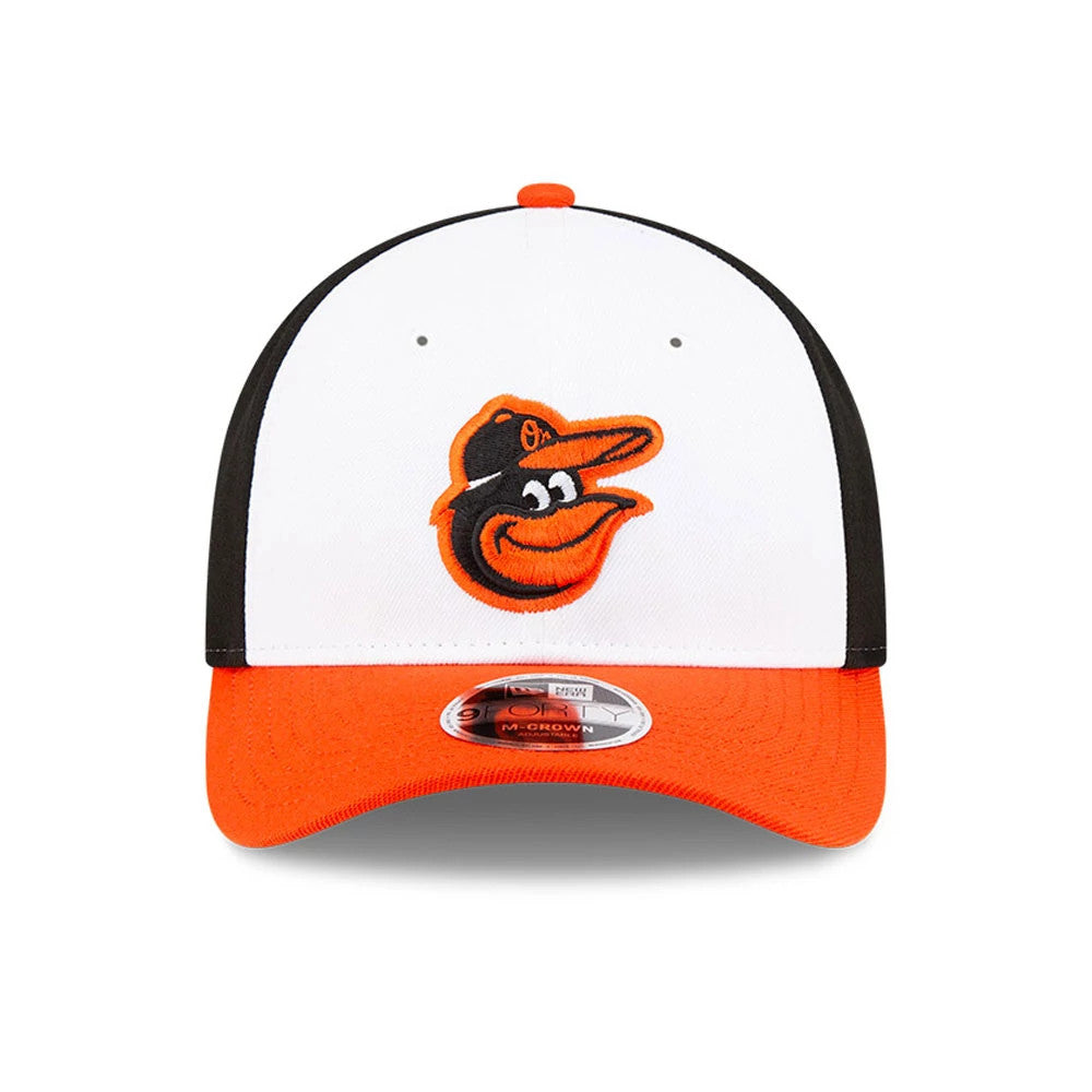 Baltimore Orioles MLB Player Replica White New Era 9FORTY M-Crown Adjustable Cap, front view showing the orange embroidered Orioles logo on the white front panels, black side panels, and orange visor with 9FORTY size sticker.