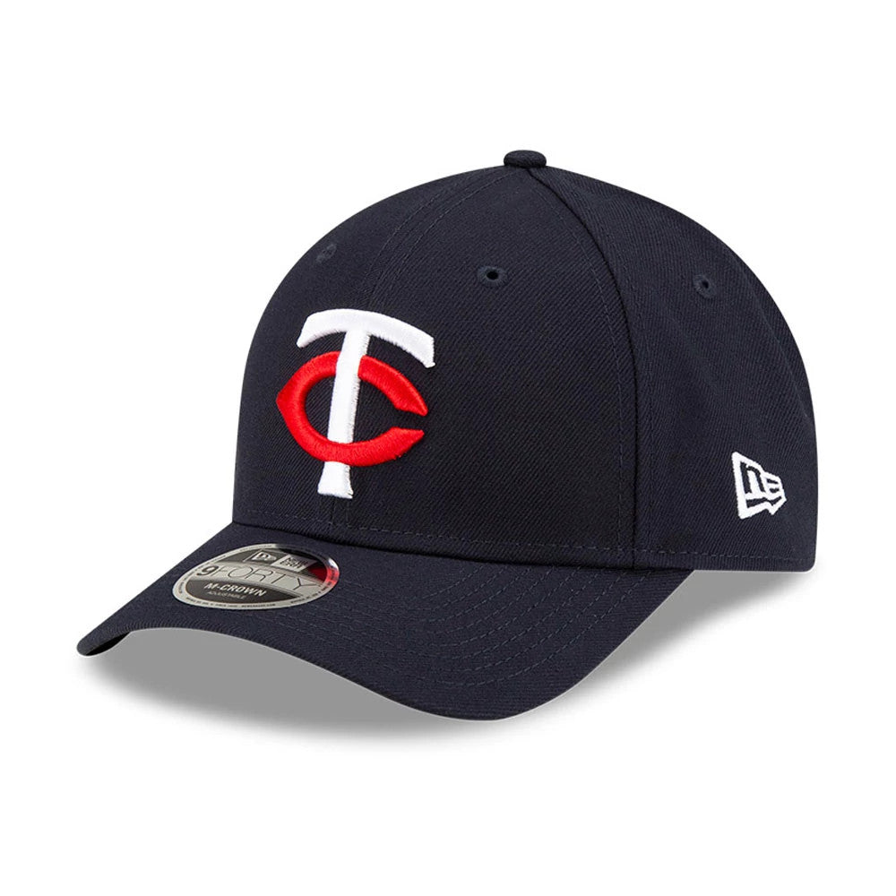 Minnesota Twins MLB Player Replica Navy New Era 9FORTY M-Crown Adjustable Cap, front view showing the raised embroidered red and white TC logo on the navy crown, curved visor with 9FORTY size sticker, and the New Era flag logo on the left side.