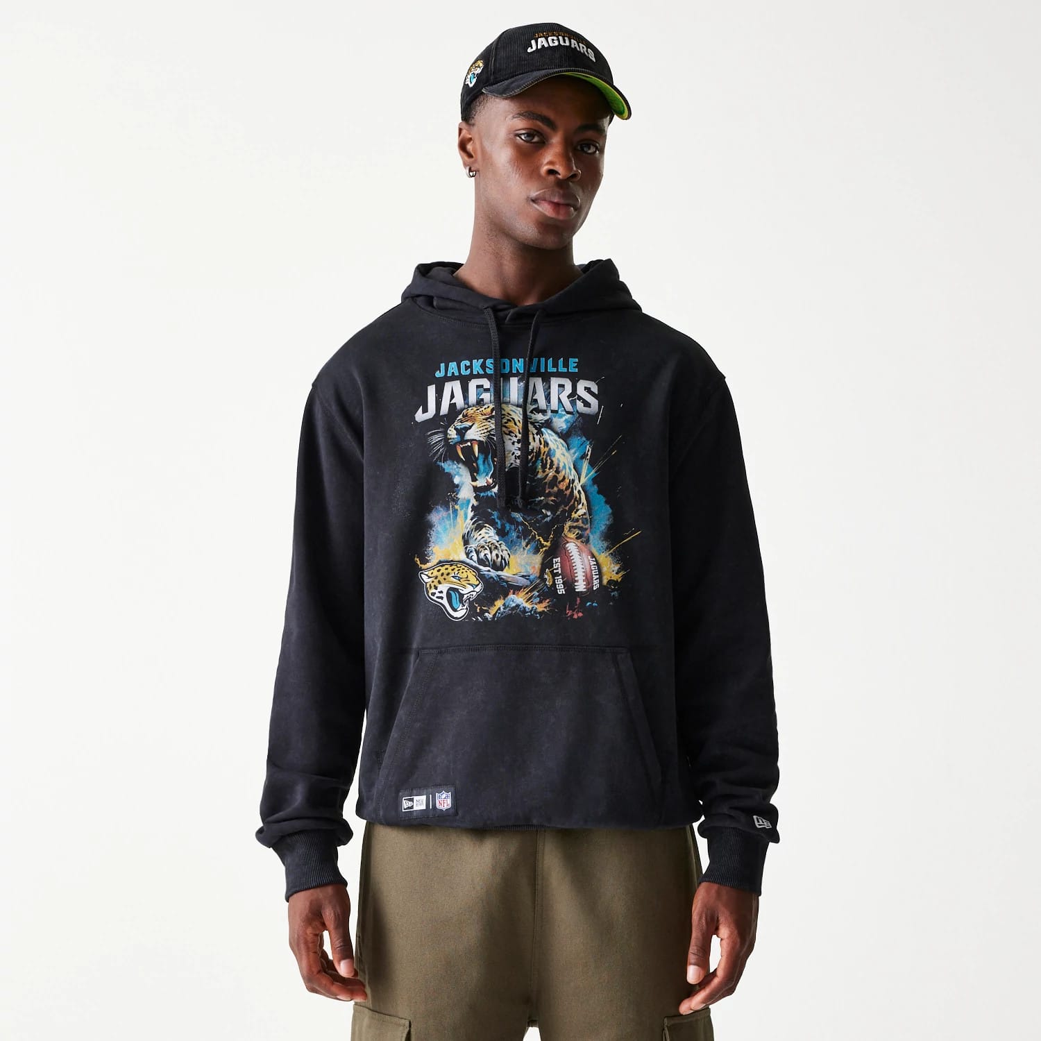 The Male model is wearing Jacksonville Jaguars NFL Games Premium Apparel Black Oversized Pullover Hoodie 1
