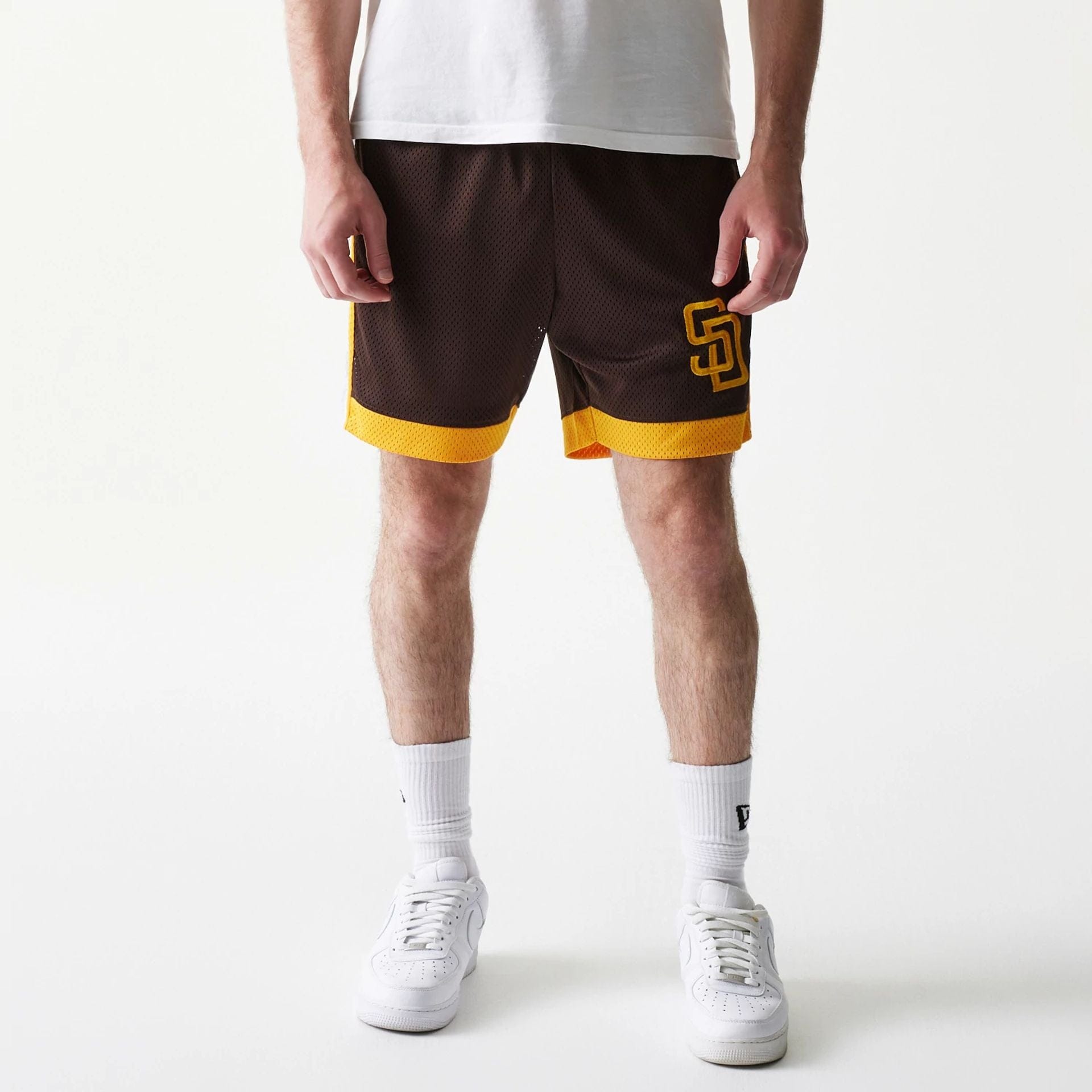 The Male model is wearing San Diego Padres Sport Classic Dark Brown Shorts 1