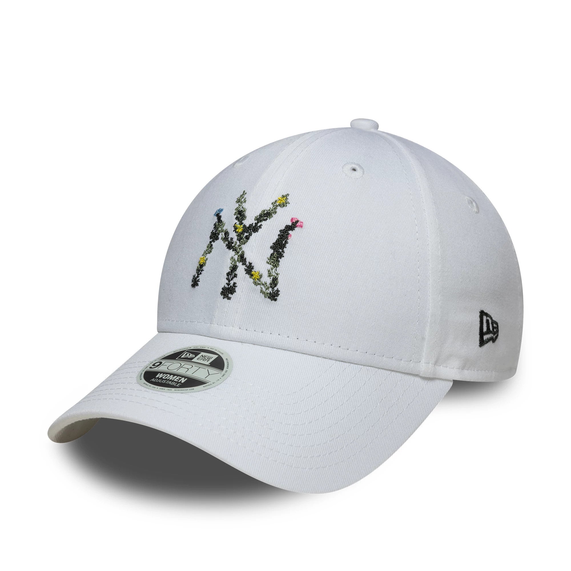 New York Yankees Womens MLB Floral Infill White New Era 9FORTY Adjustable Cap, three-quarter view with a multicoloured floral NY logo on the front panel, a white curved visor with a 9FORTY size sticker, and New Era flag logo on the left side.