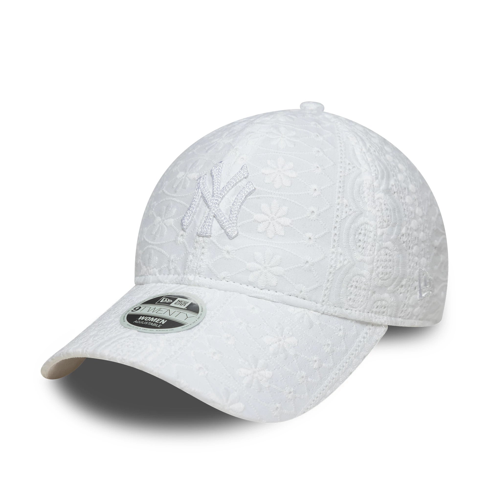 New York Yankees Womens MLB Broderie White New Era 9TWENTY Adjustable Cap, three-quarter view showing the white embroidered NY logo on the front panel, intricate broderie pattern, and 9TWENTY size sticker on the curved visor.