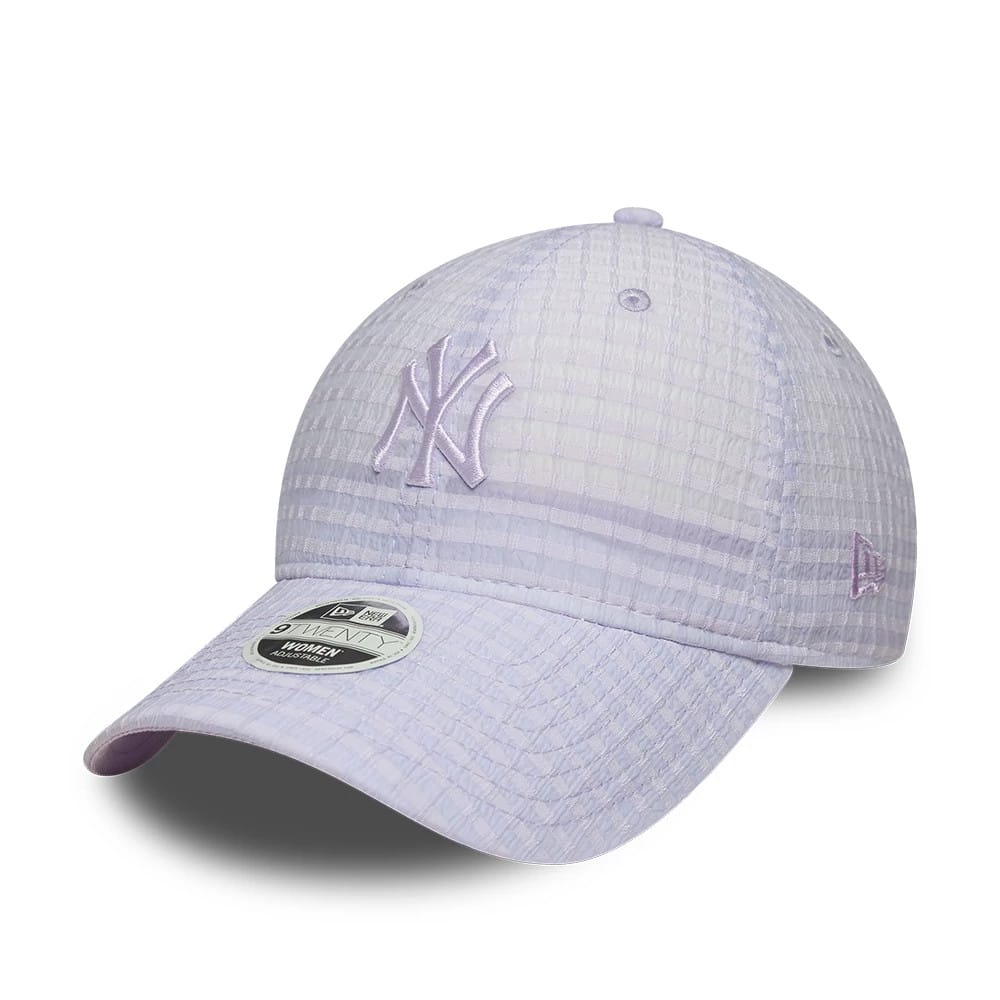 New York Yankees Womens MLB Seersucker Pastel Purple New Era 9TWENTY Adjustable Cap, three-quarter view showing the purple embroidered NY logo on the front panels, curved visor with 9TWENTY size sticker and New Era flag logo on the left side.