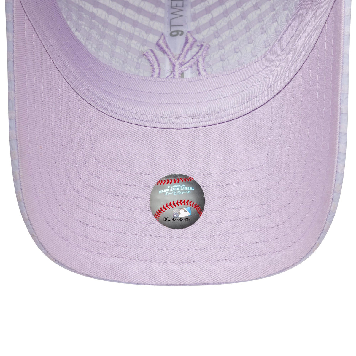 New York Yankees Womens MLB Seersucker Pastel Purple New Era 9TWENTY Adjustable Cap, inside view showing the pastel purple undervisor, embroidered NY logo on the taping, and official MLB holographic sticker on the underside of the visor.