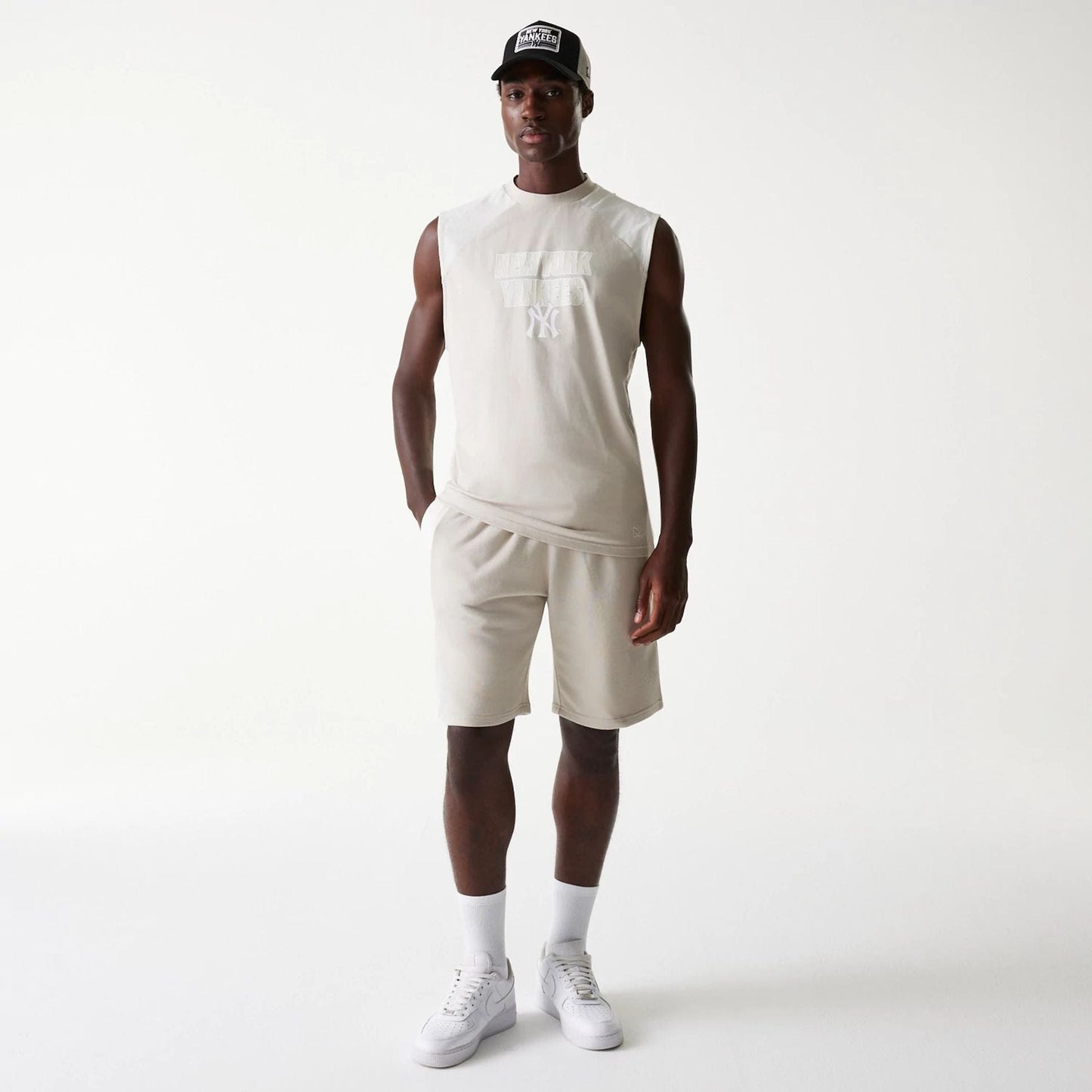 The Male model is wearing New York Yankees MLB Cream Sleeveless T-Shirt 8