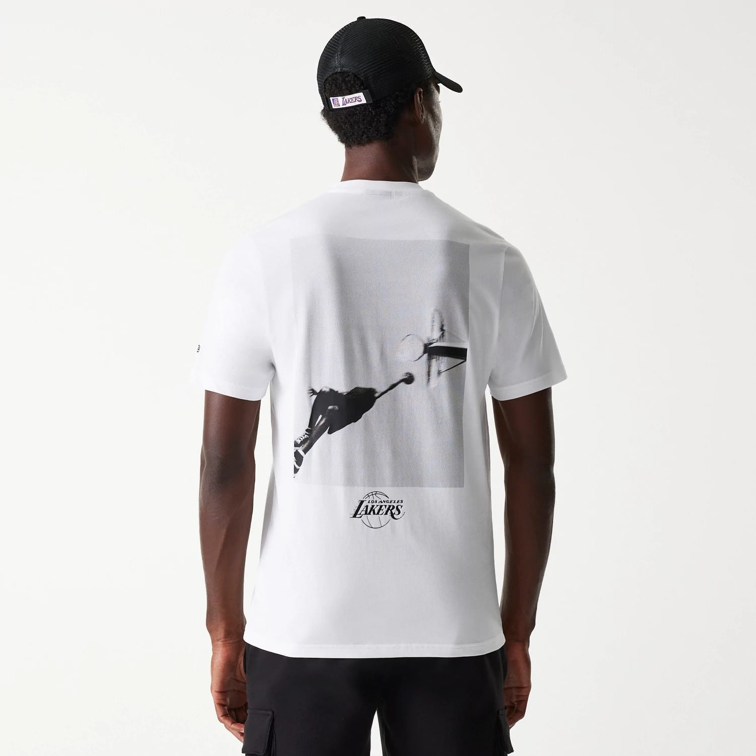 New Era LA Lakers NBA Court Graphic White T-Shirt, rear view showing a black-and-white graphic of a basketball player going for a dunk, with the team logo printed below the image on a plain white background.