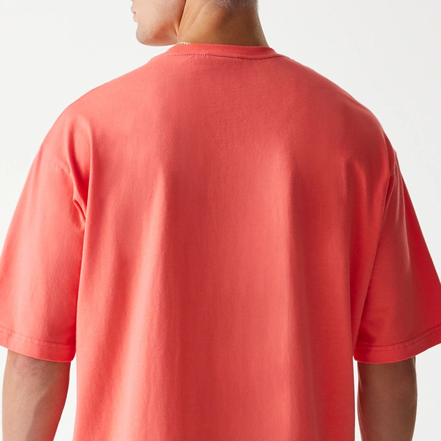 The Male model is wearing Chicago Bulls NBA All Over Print Infill Pink Oversized T-Shirt 7