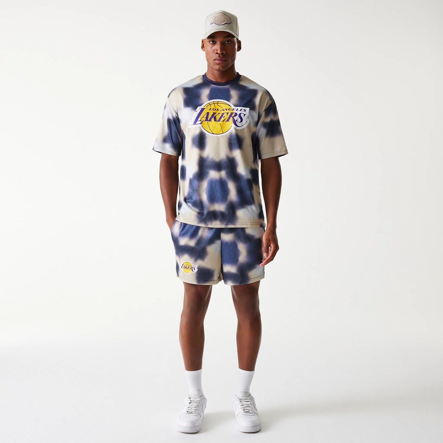 The Male model is wearing LA Lakers NBA All Over Print Cream Oversized T-Shirt 8