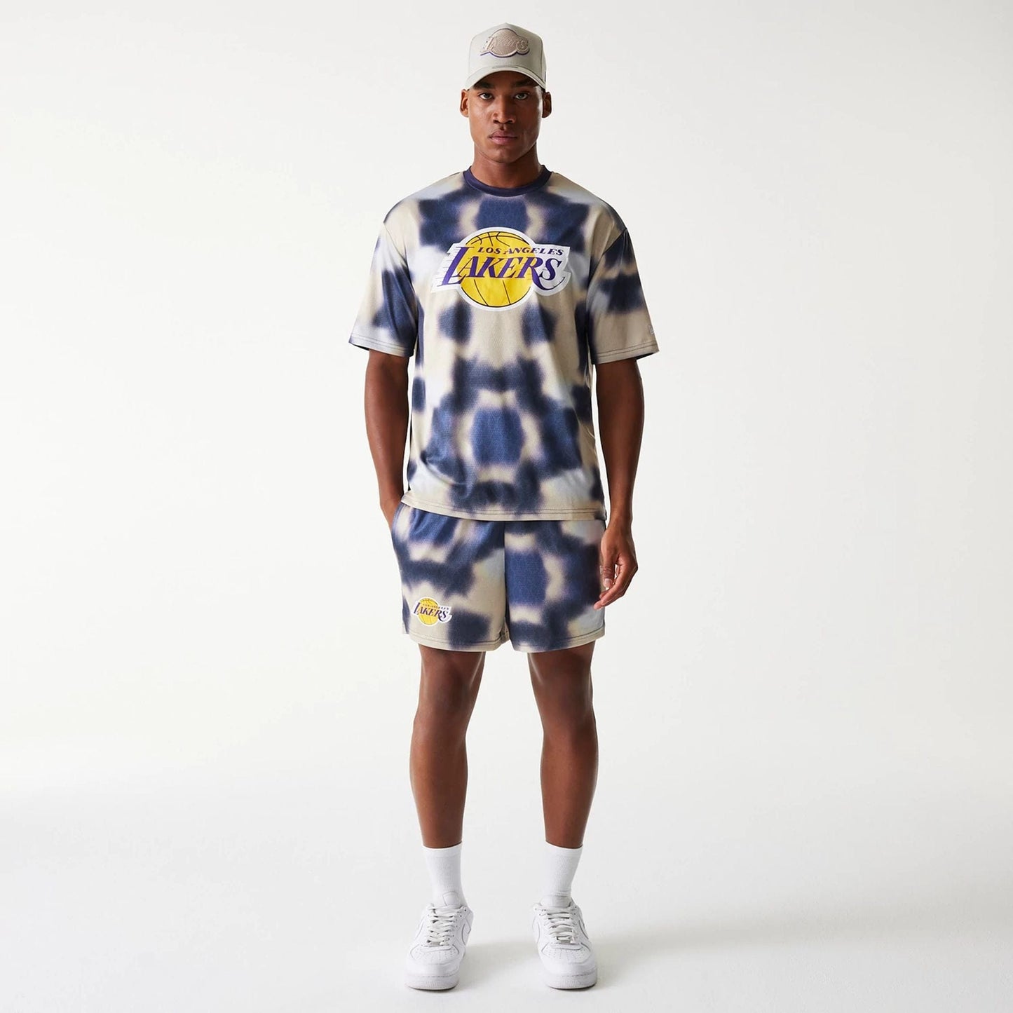 The Male model is wearing LA Lakers NBA All Over Print Cream Oversized T-Shirt 8