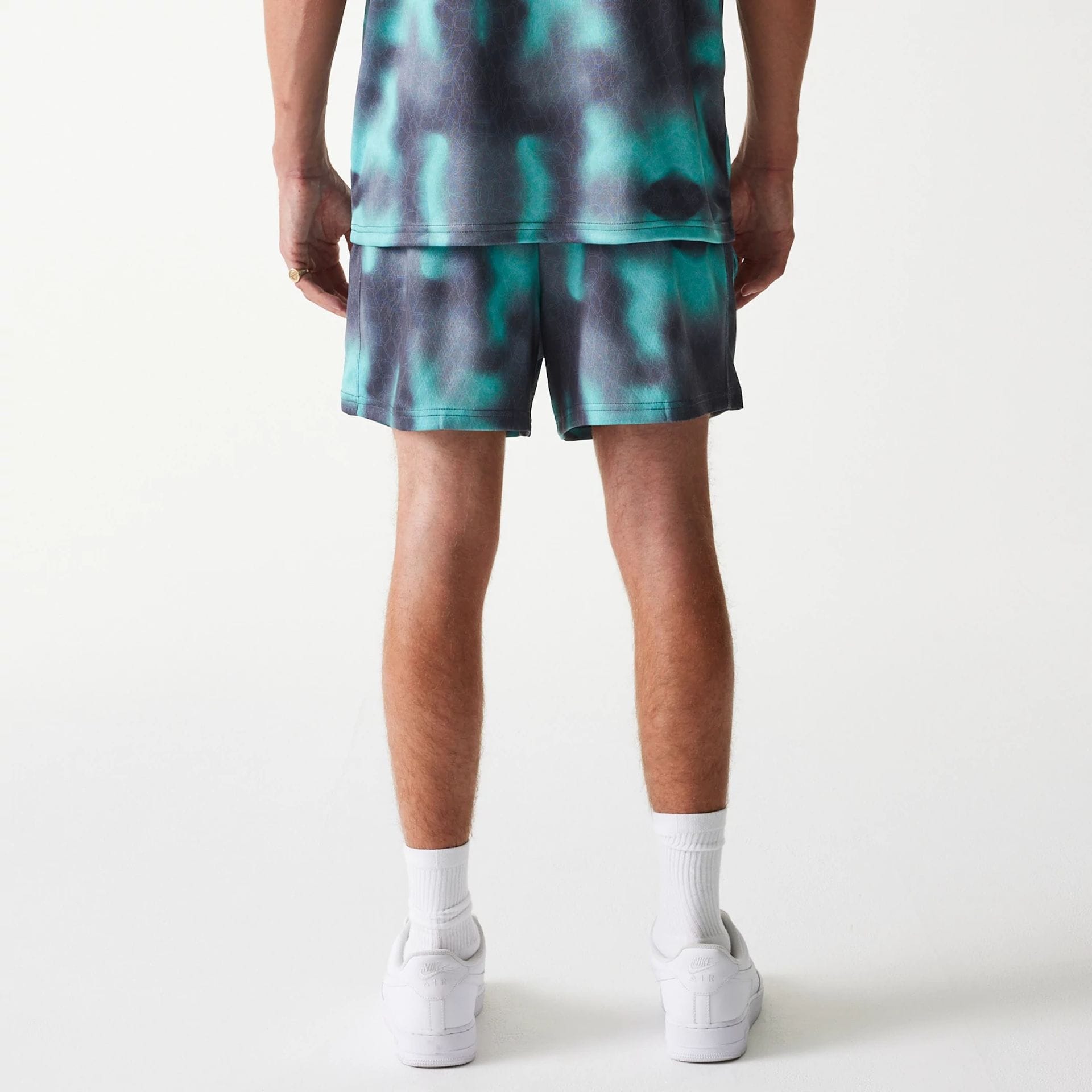 The Male model is wearing Chicago Bulls NBA All Over Print Green Shorts 2