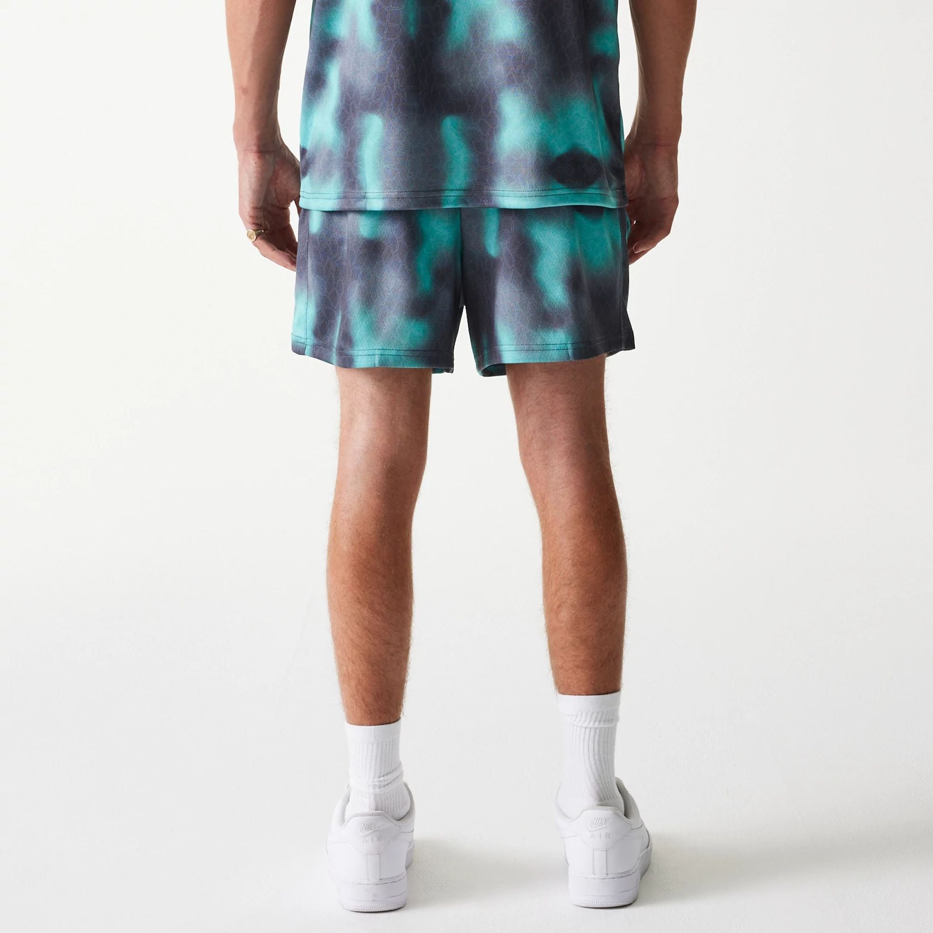 The Male model is wearing Chicago Bulls NBA All Over Print Green Shorts 2