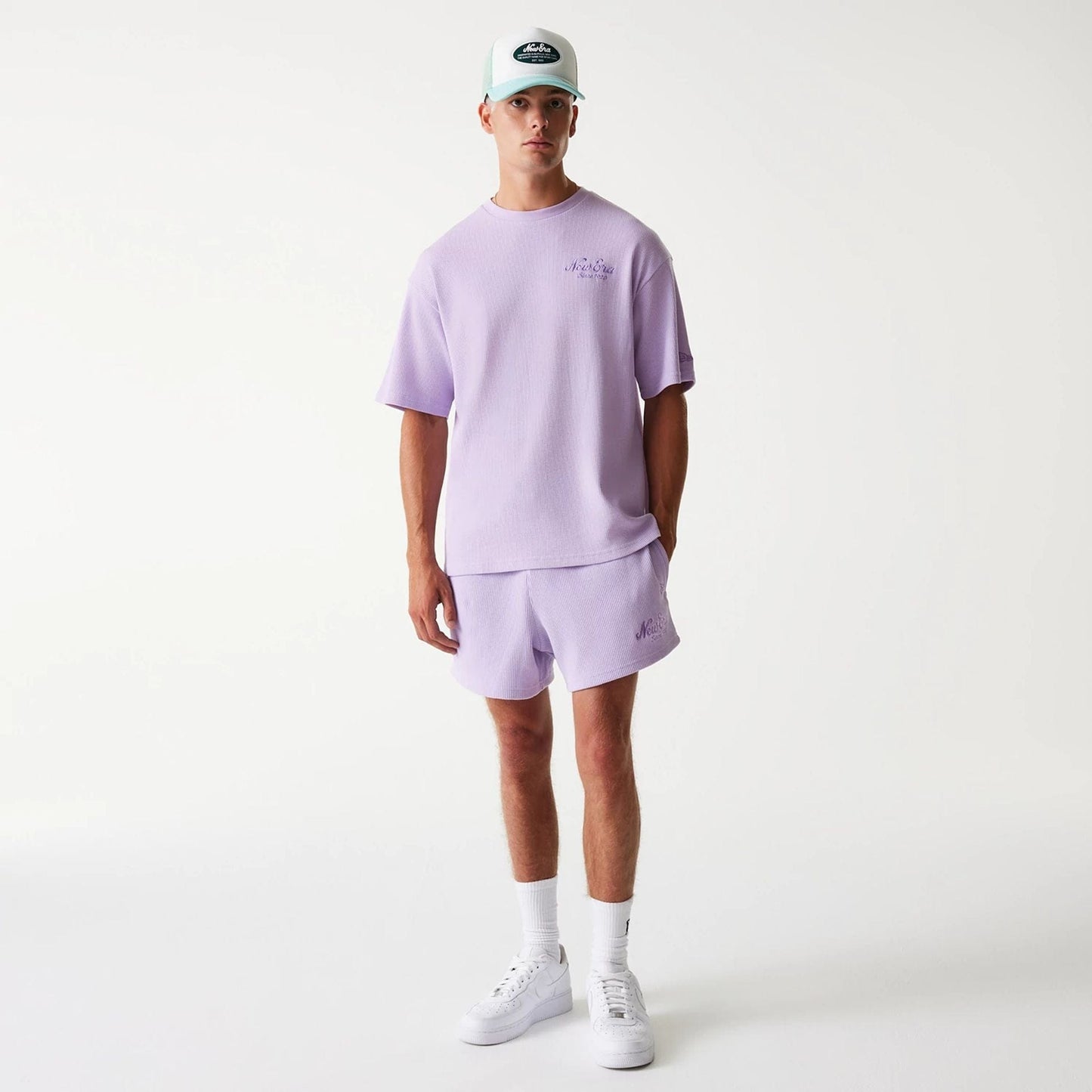 The Male model is wearing New Era Waffle Pastel Purple Oversized T-Shirt 8