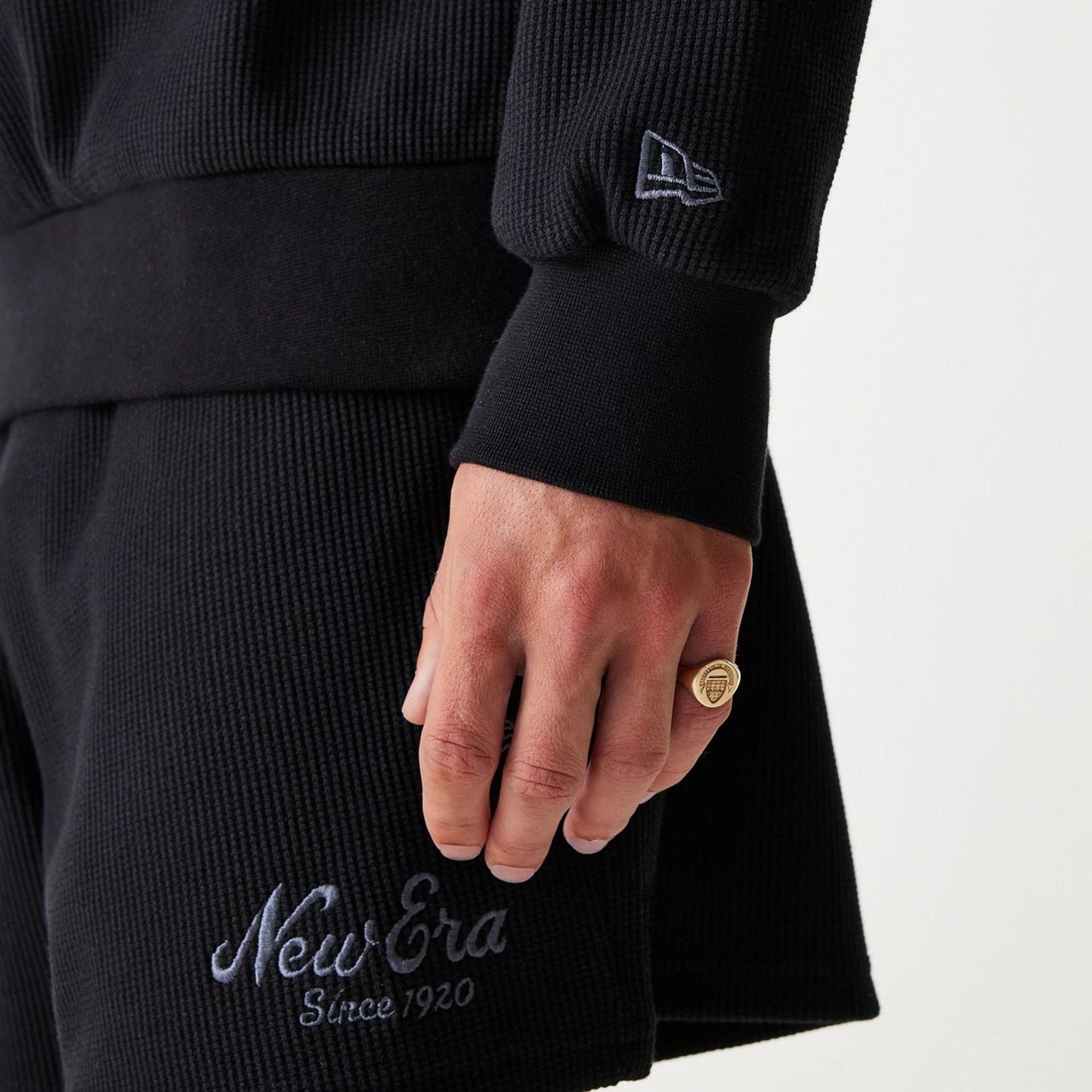 The Male model is wearing New Era Waffle Black Oversized Crew Neck Sweater 8