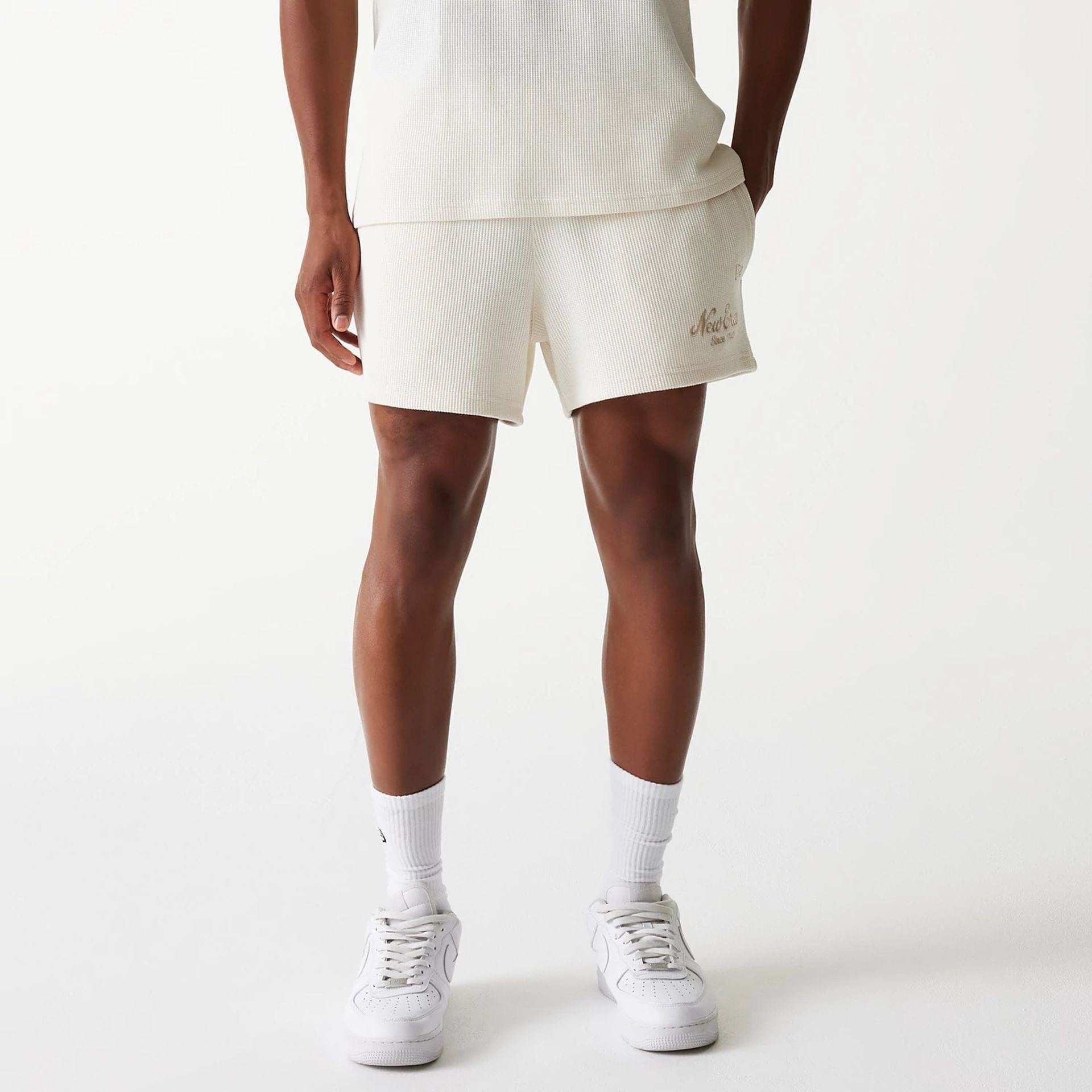 The Male model is wearing New Era Waffle Open White Shorts 1