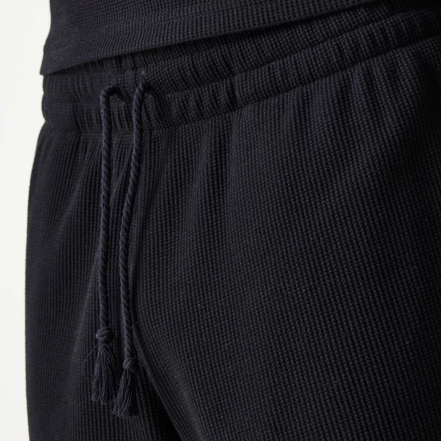 The Male model is wearing New Era Waffle Black Shorts 8