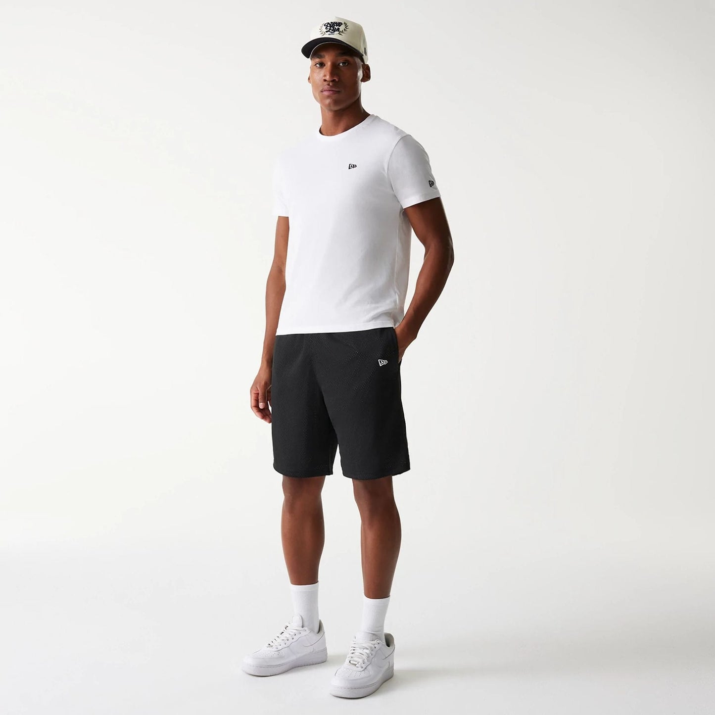 The Male model is wearing New Era Black Mesh Shorts 8