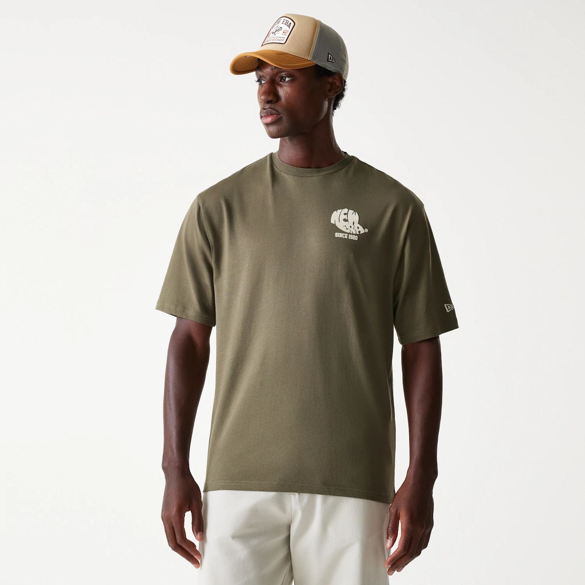 The Male model is wearing New Era Graphic Green Oversized T-Shirt 1
