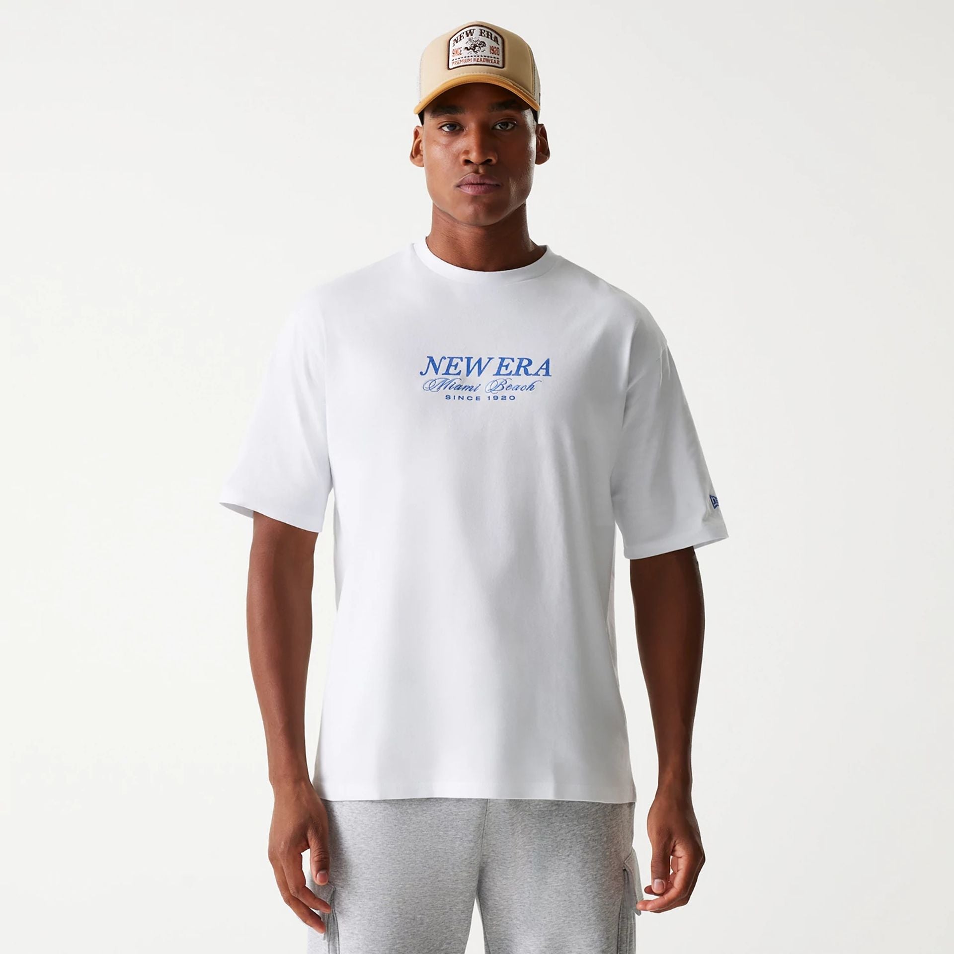 The Male model is wearing New Era Vacation Graphic White Oversized T-Shirt 2