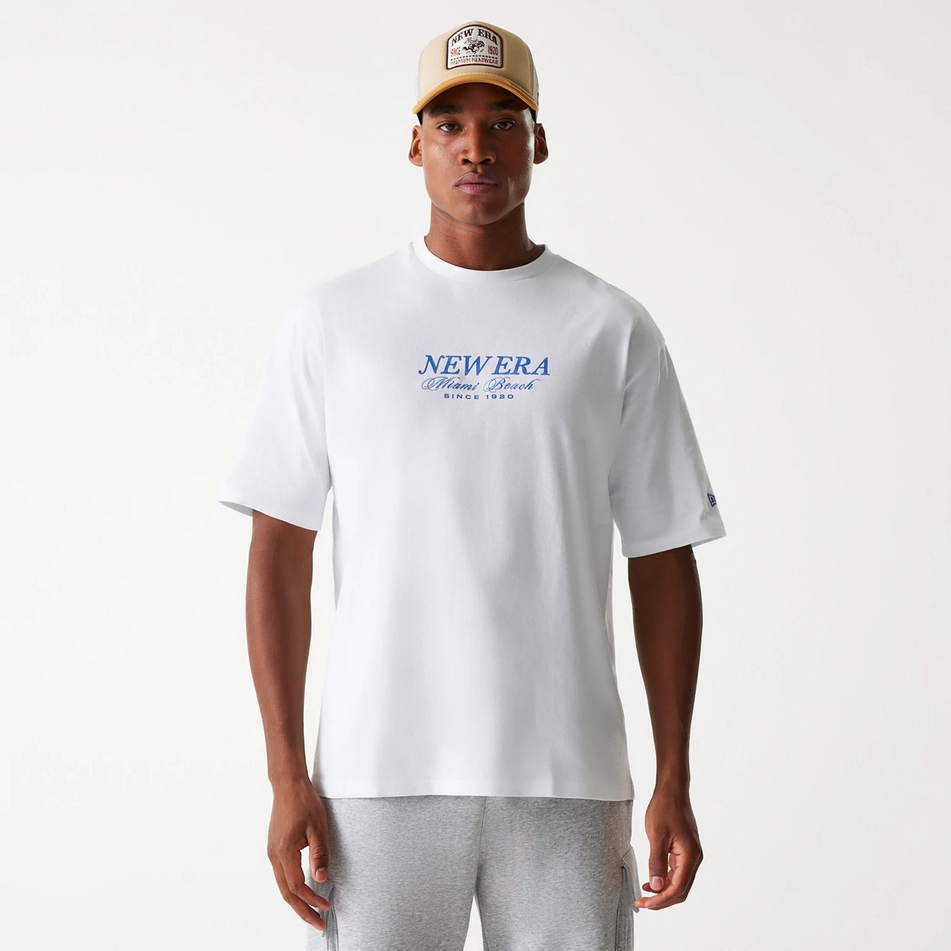 The Male model is wearing New Era Vacation Graphic White Oversized T-Shirt 2