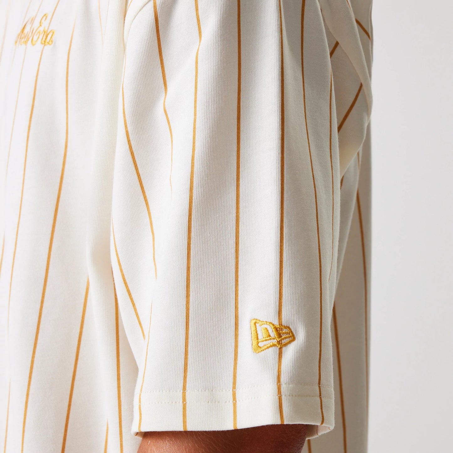 The Male model is wearing New Era Pinstripe Open White Oversized T-Shirt 8