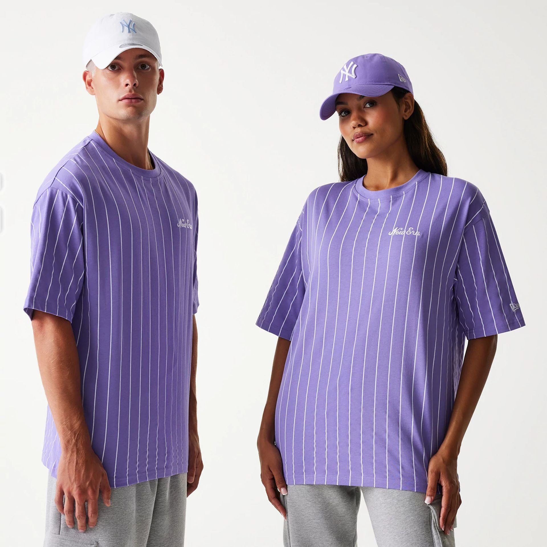 The Male model is wearing New Era Pinstripe Purple Oversized T-Shirt 1