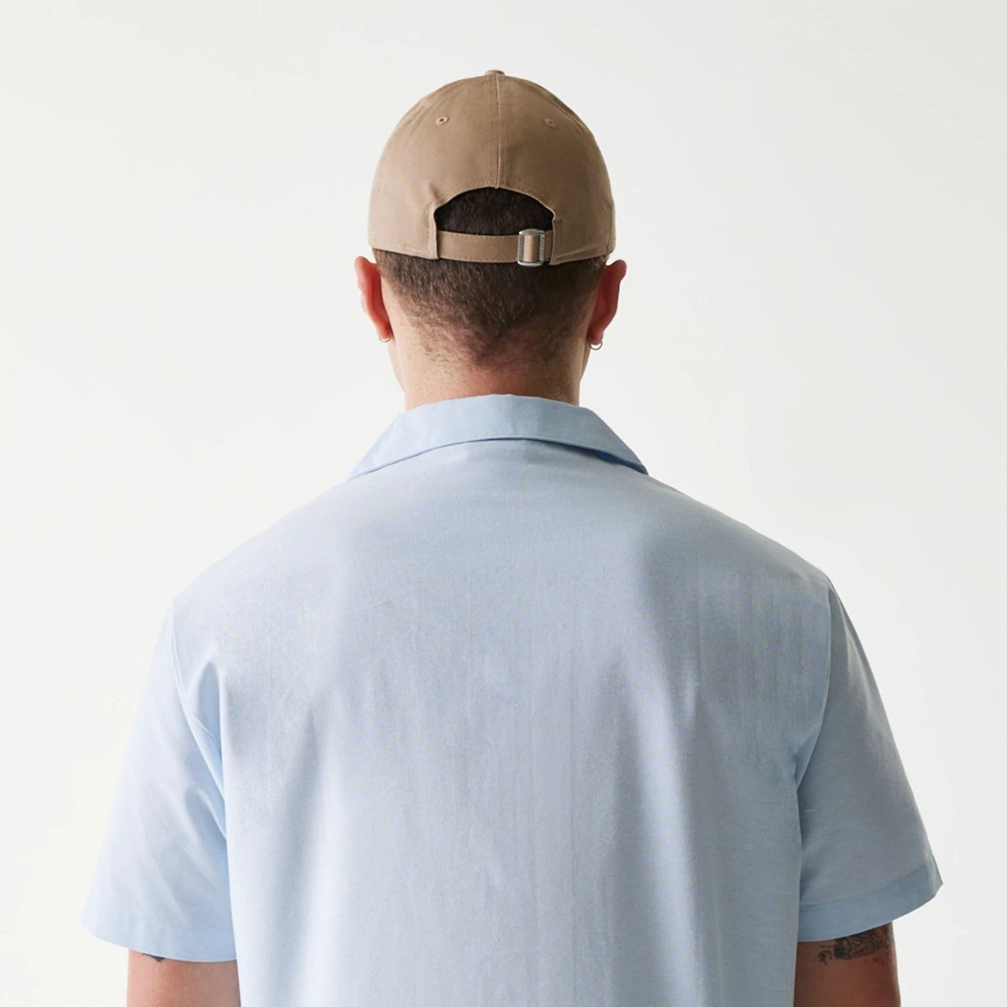 The Male model is wearing New Era Pastel Blue Revere Short Sleeve Shirt 7