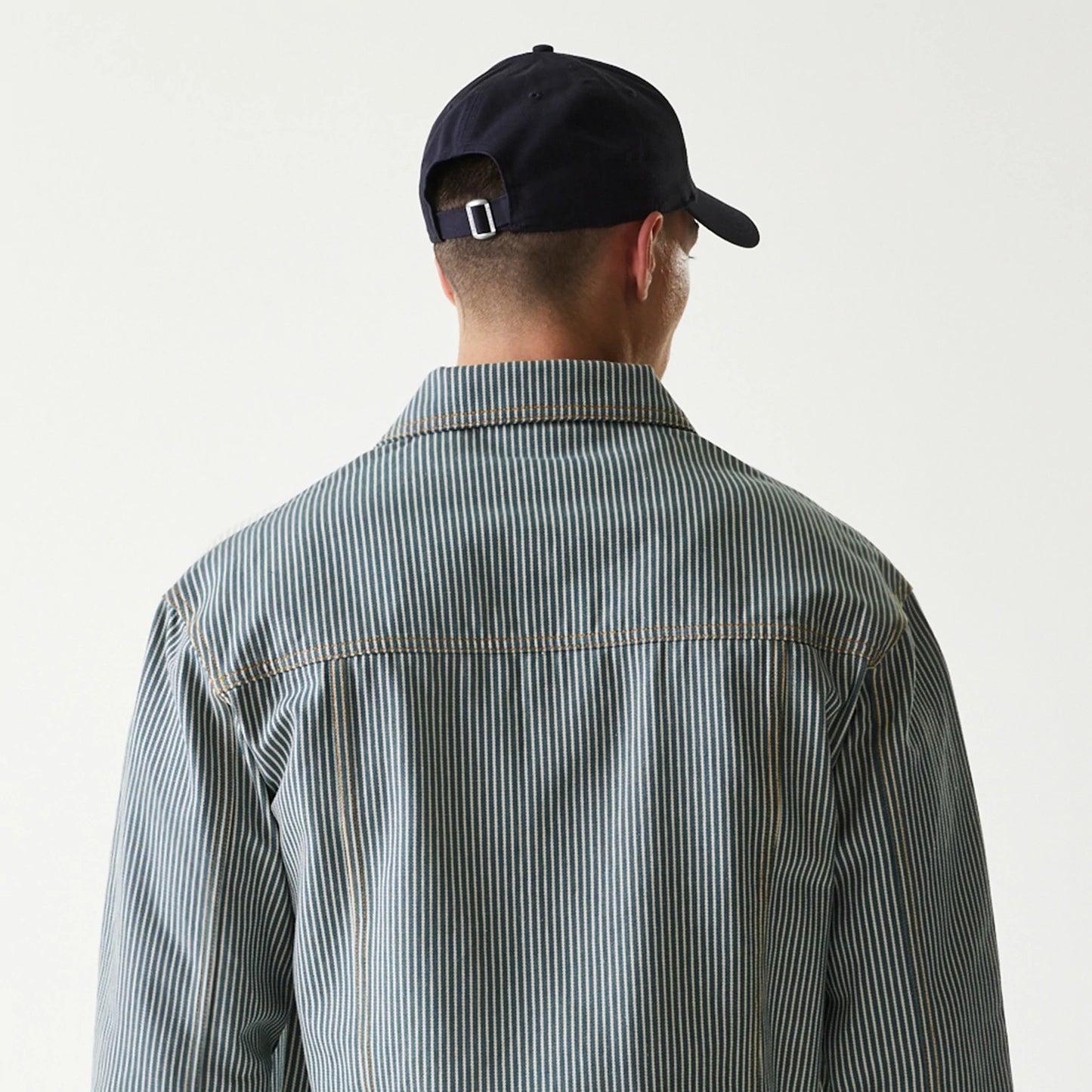 The Male model is wearing New Era Blue Denim Jacket 8
