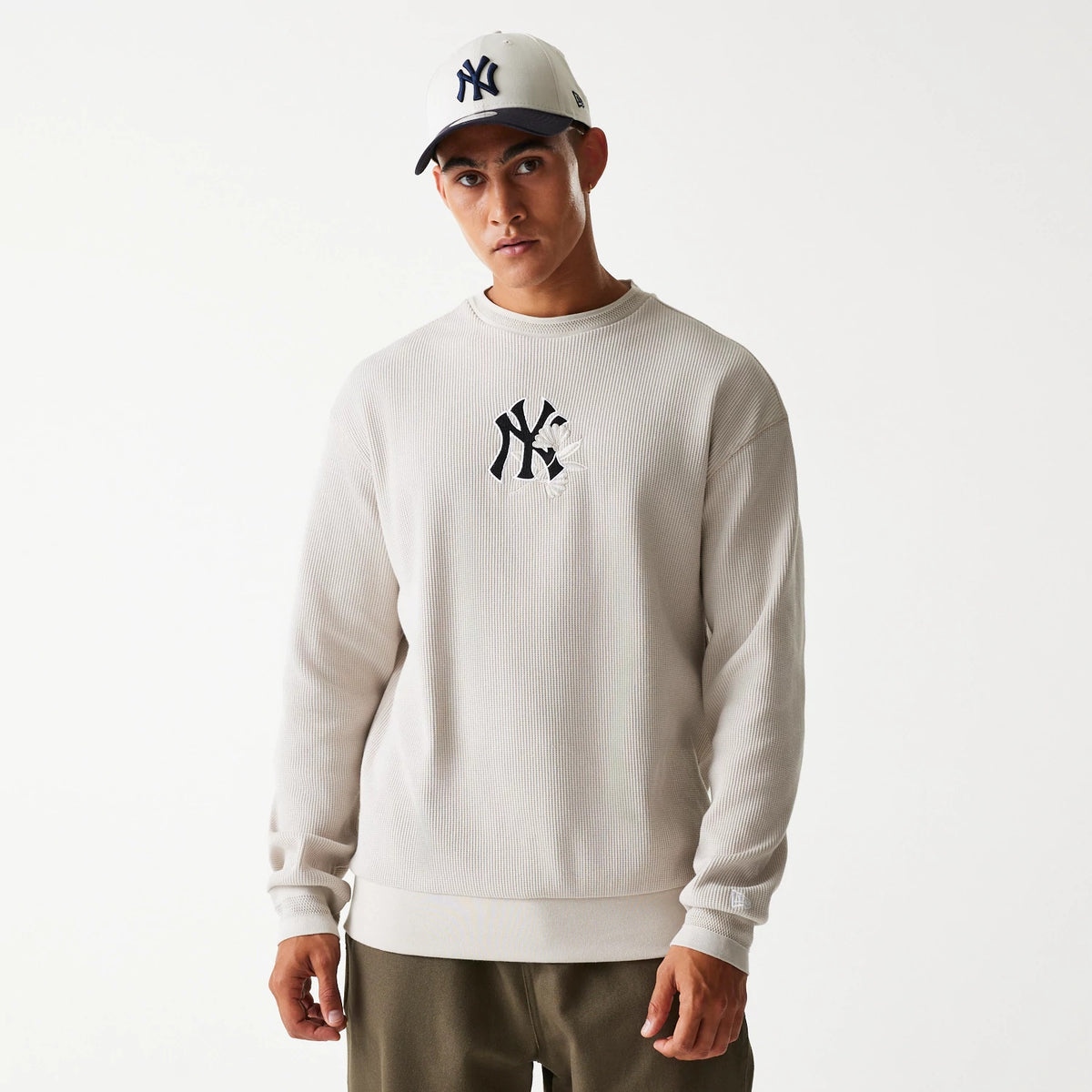 The Male model is wearing New York Yankees MLB Waffle Cream Oversized Crew Neck Sweater 1