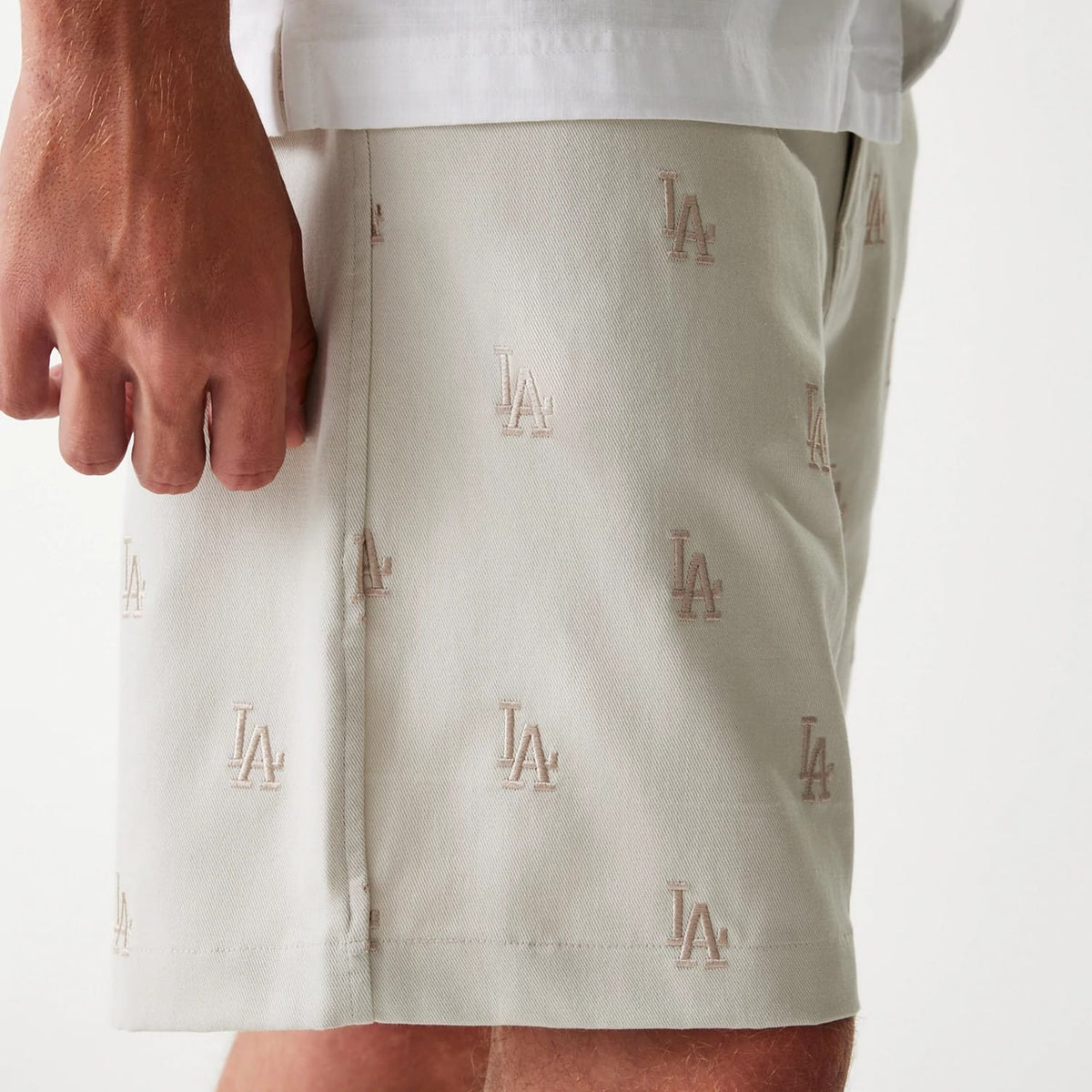 The Male model is wearing LA Dodgers MLB Monogram Cream Shorts 4