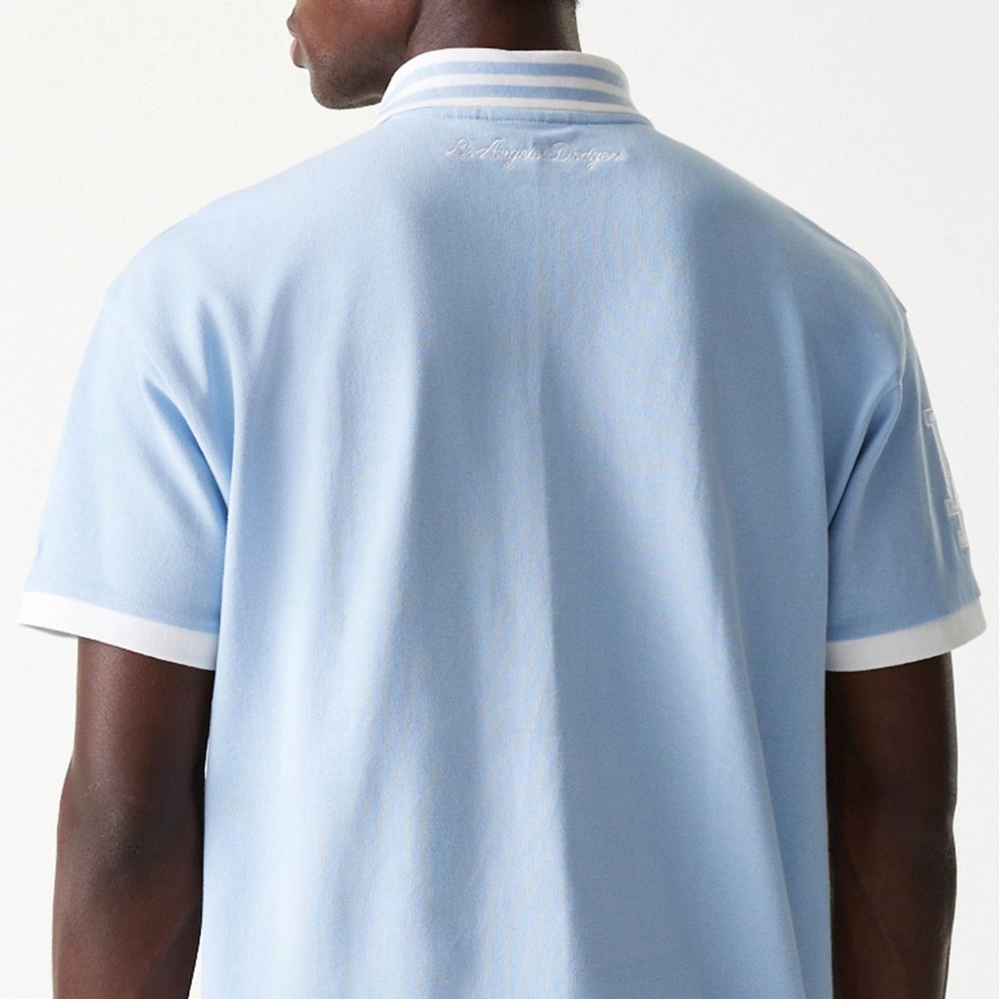 The Male model is wearing LA Dodgers MLB Graphic Pastel Blue Polo Shirt 7