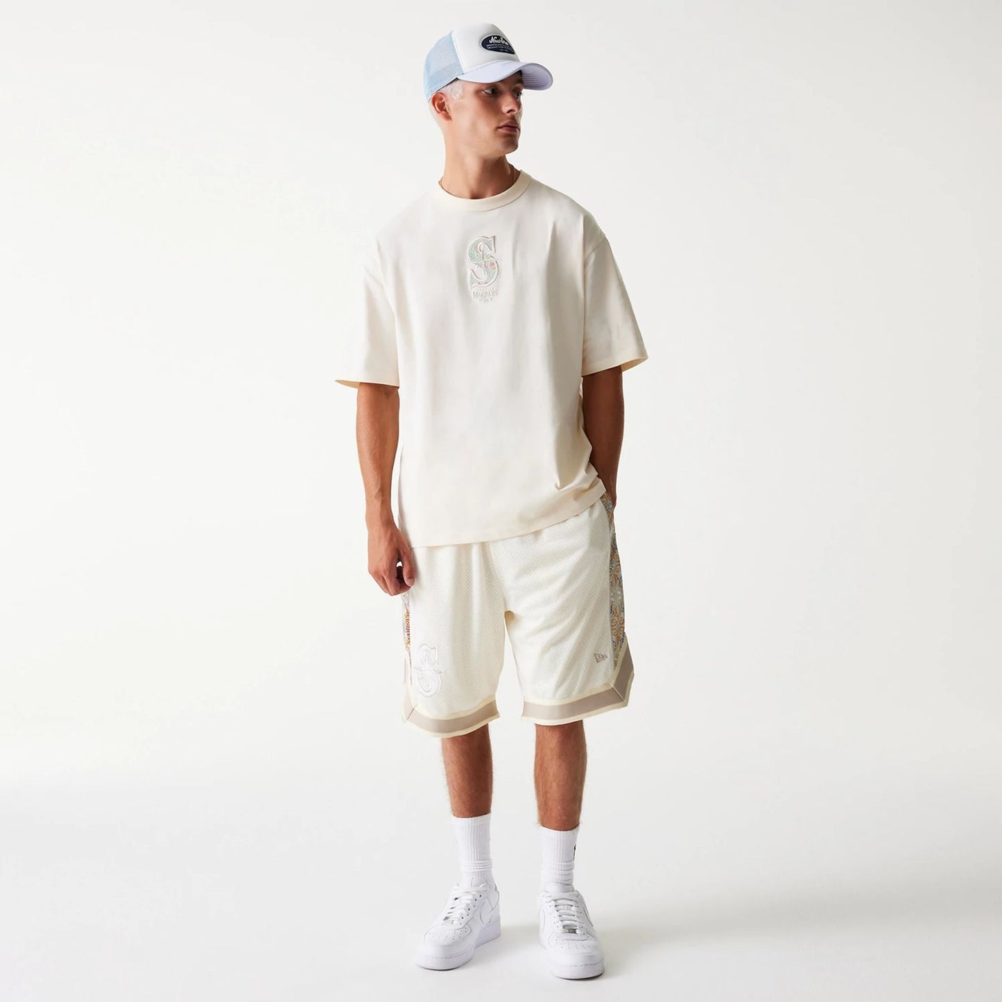 The Male model is wearing Seattle Mariners MLB Infill Open White Oversized T-Shirt 8