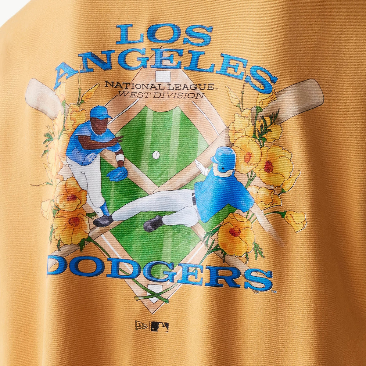 New Era LA Dodgers MLB Graphic Beige Revere Short Sleeve Shirt, rear view showing a vibrant graphic with baseball players, flowers, and LOS ANGELES DODGERS text, accented by the MLB Batterman logo at the bottom.