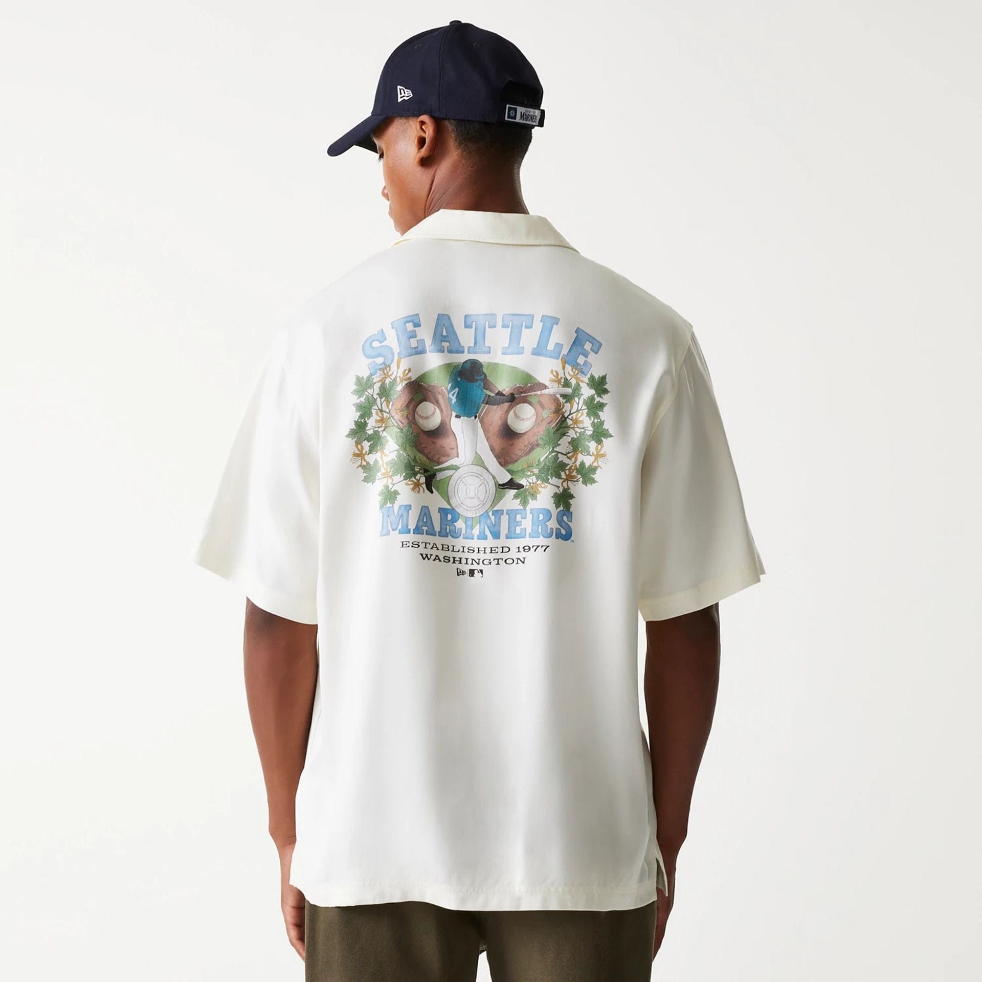The Male model is wearing Seattle Mariners MLB Graphic Open White Revere Short Sleeve Shirt 2